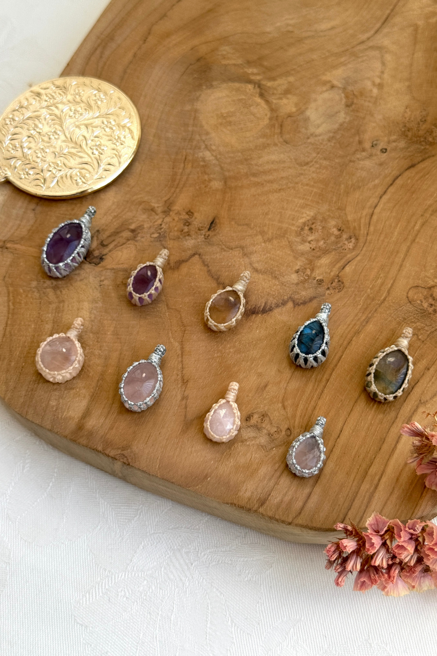 Side view close-up of Candy Charms – detailed macrame wrapping around natural gemstones, highlighting their unique designs and lightweight nature.