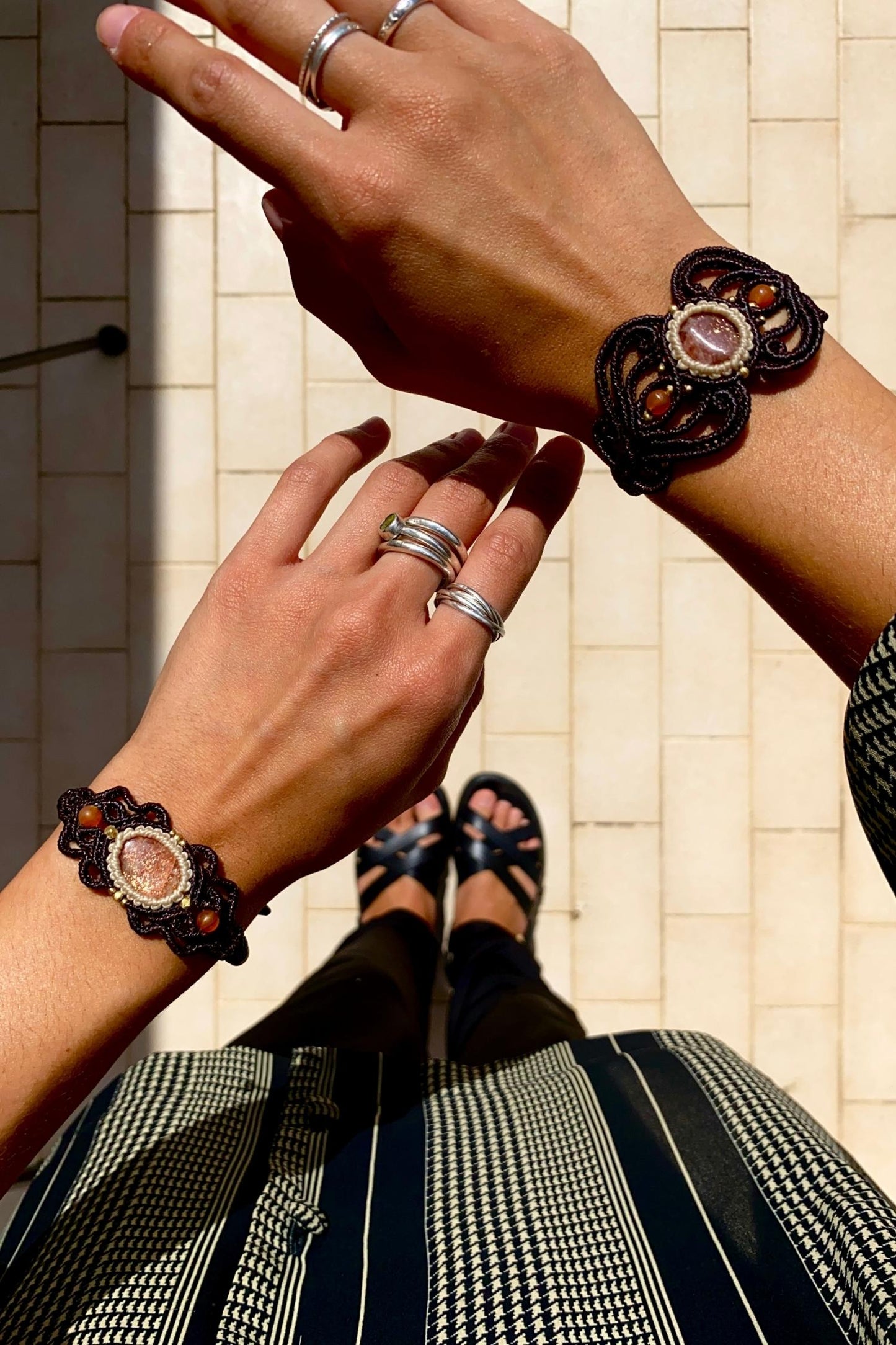 Elegant final styled shot of the handmade bracelet, highlighting its unique design with Sunstone and carnelian gemstones and adjustable closure, perfect for adding a pop of color to any outfit.