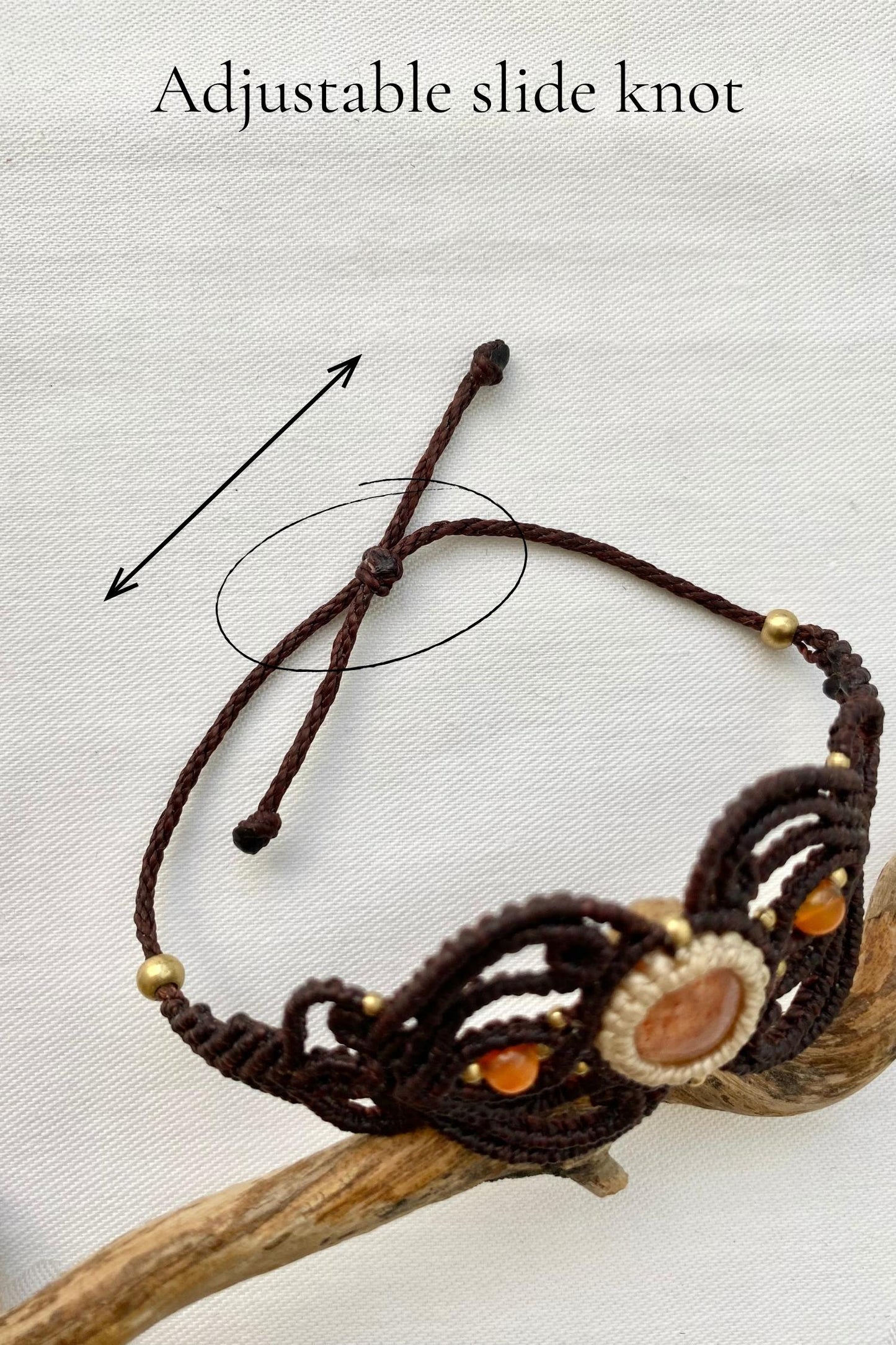Detailed shot of the adjustable knot closure of the handmade bracelet, ensuring a secure and comfortable fit, designed to adjust to different wrist sizes.