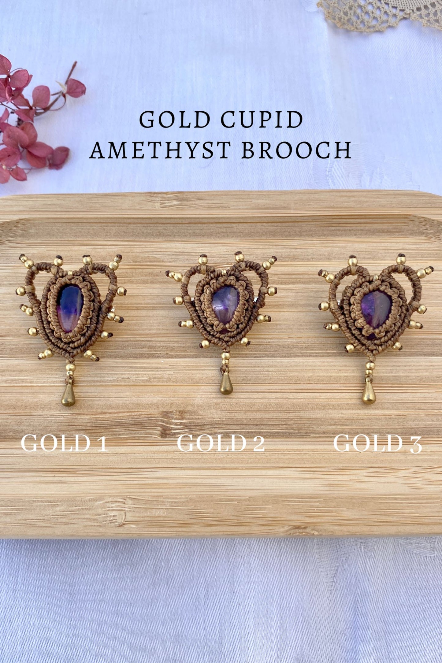 Collection of handmade Cupid Amethyst Brooches with gold bead accents, showcasing the variety of natural amethyst gemstones in each unique design.