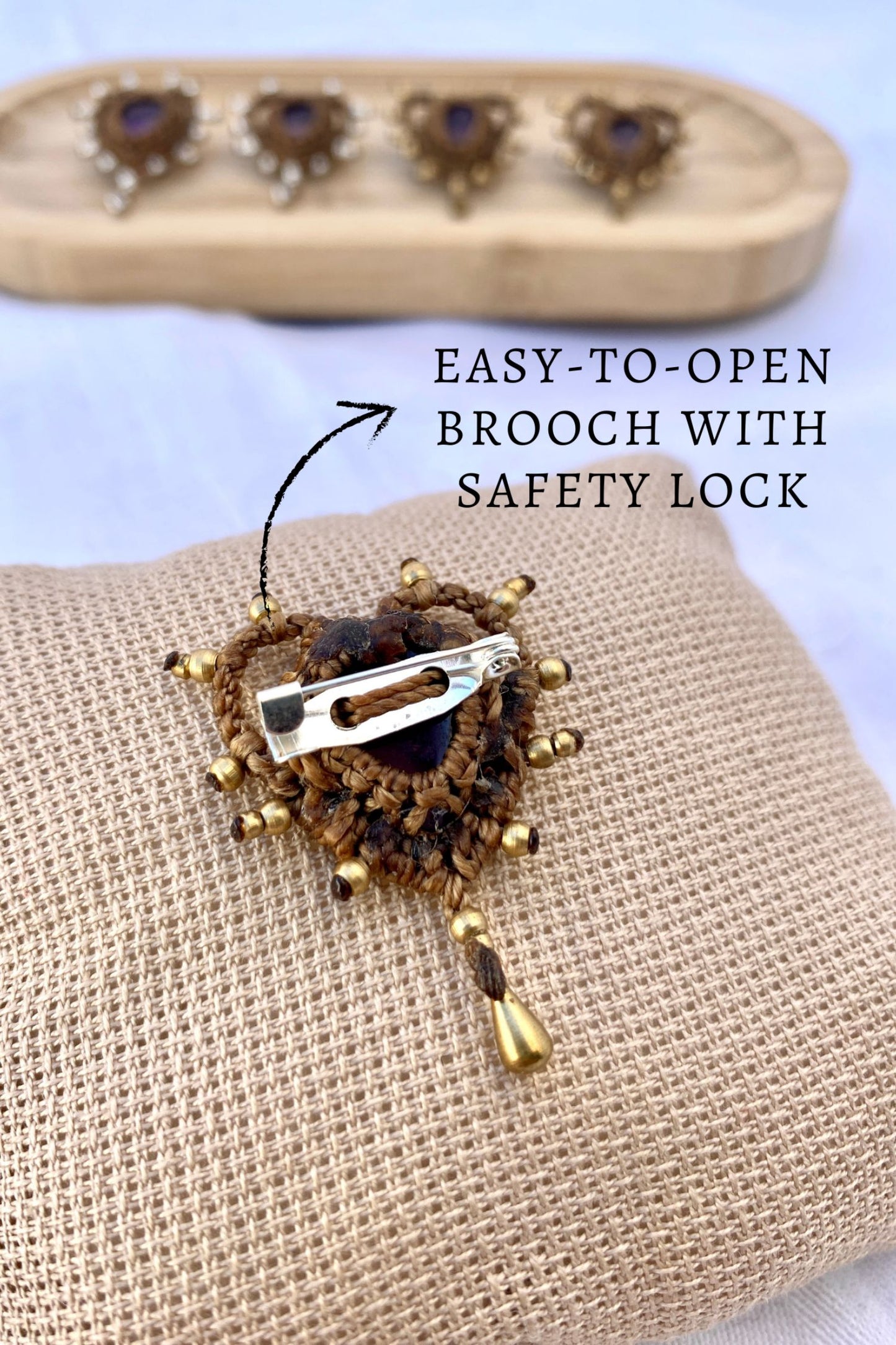 Back view of the Cupid Amethyst Brooch, showcasing the secure safety lock closure for easy wear and a firm hold.