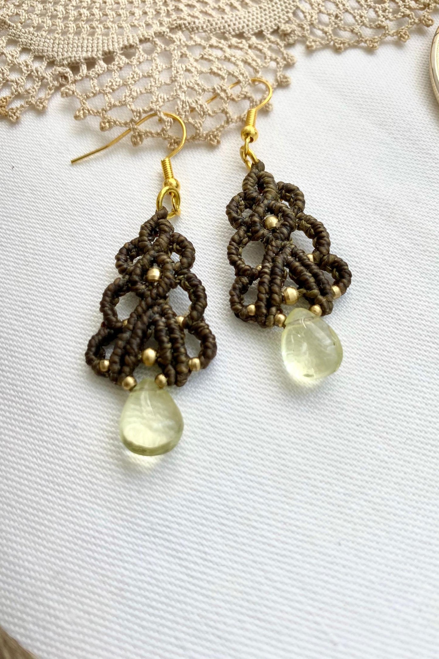 Close-up of the handmade Lemon Quartz earrings, showcasing the gemstone’s natural brilliance and the sleek stainless steel hook design.