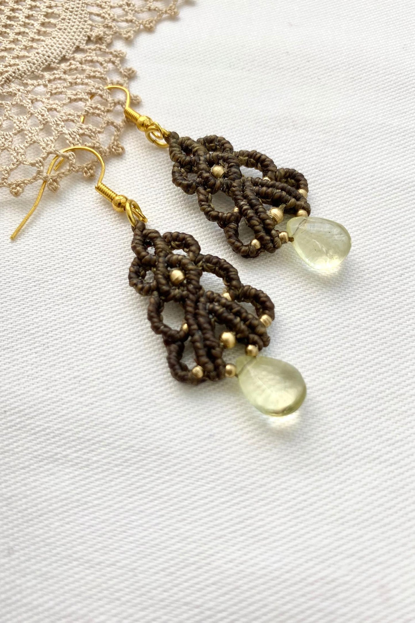 Side angle of the lightweight gemstone earrings, highlighting the delicate movement and the elegant Lemon Quartz gemstones.