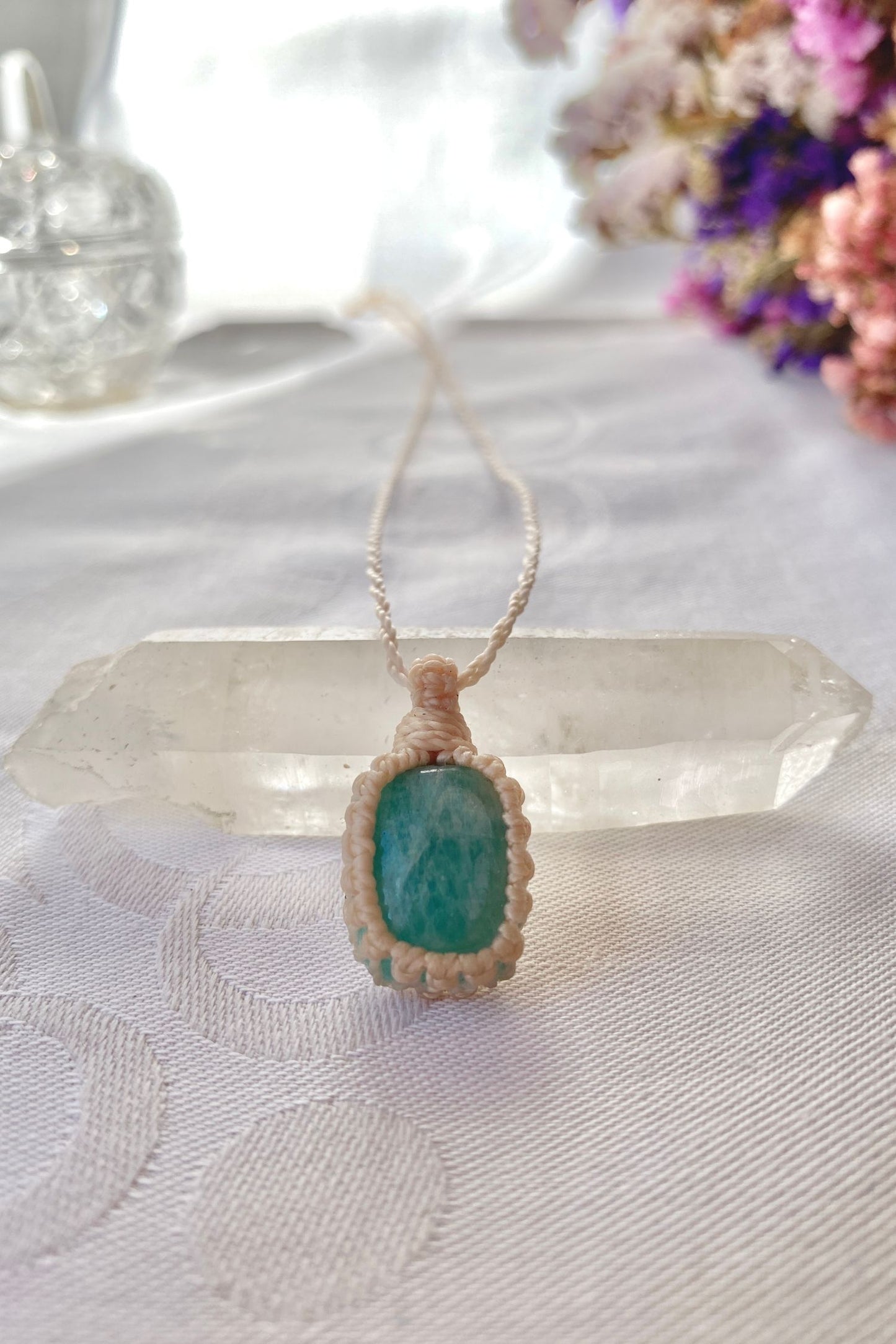 Handmade Amazonite Macrame necklace featuring a high-quality blue gemstone, laid flat to showcase its delicate everyday-wear design from the Essence collection.