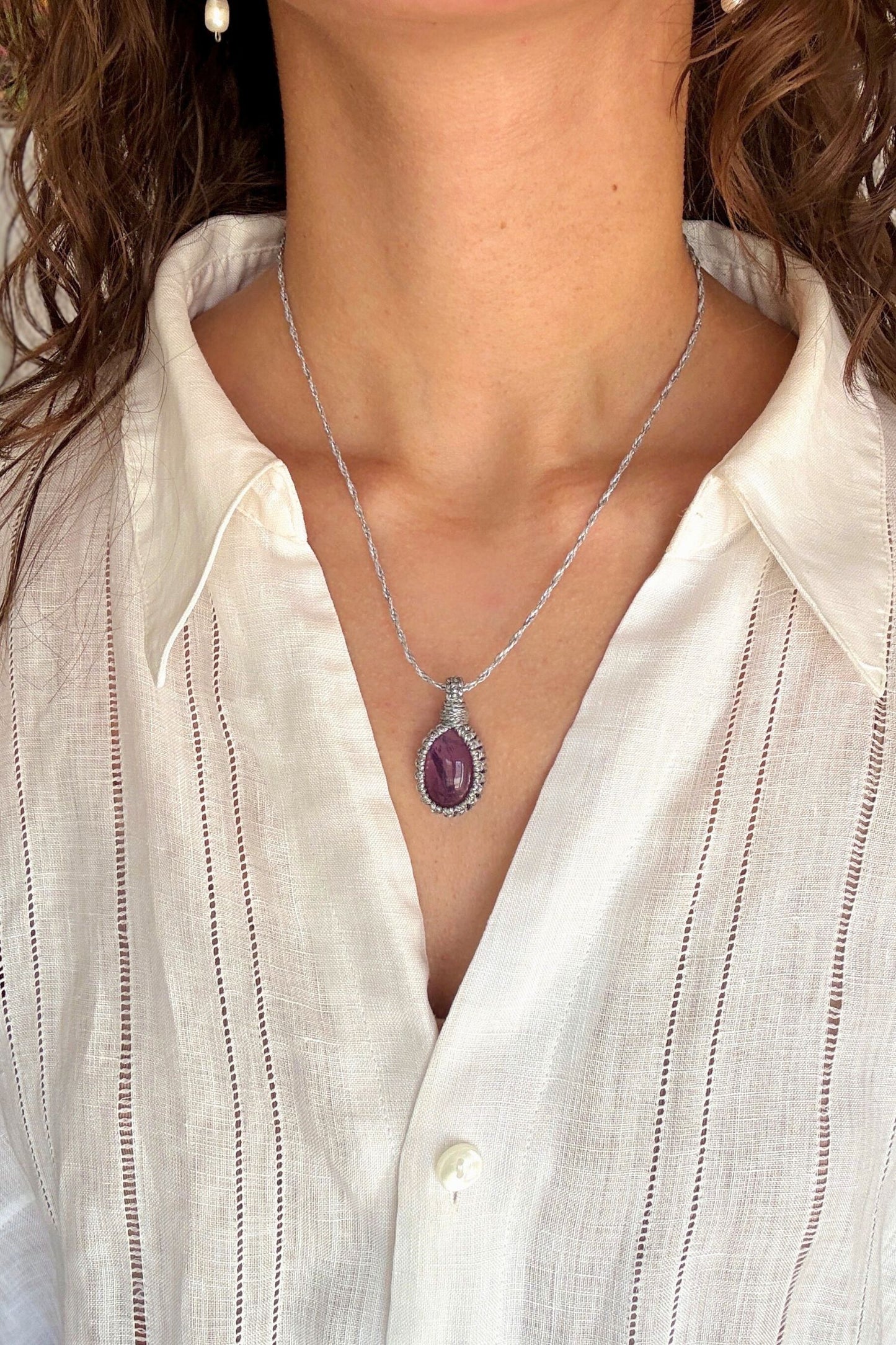 Model wearing a delicate handmade Amethyst macrame necklace with a silver cord, perfect for everyday wear.