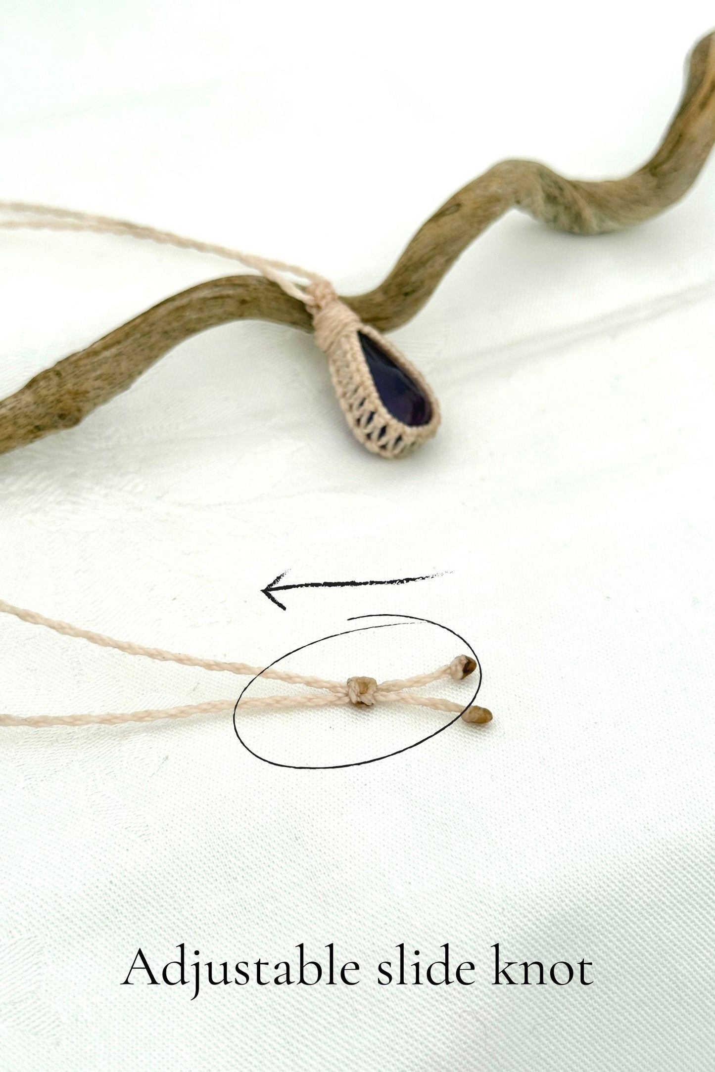 Close-up of the adjustable sliding knot on the Amethyst Macrame necklace, allowing for an easy and customizable fit for any wearer.