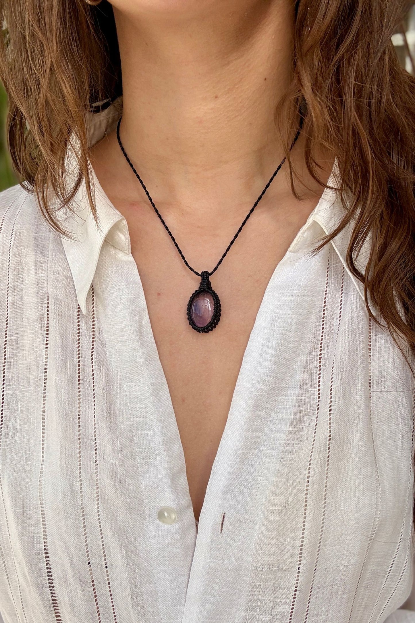 Model wearing a delicate handmade Ametrine macrame necklace with a black cord, perfect for everyday wear.