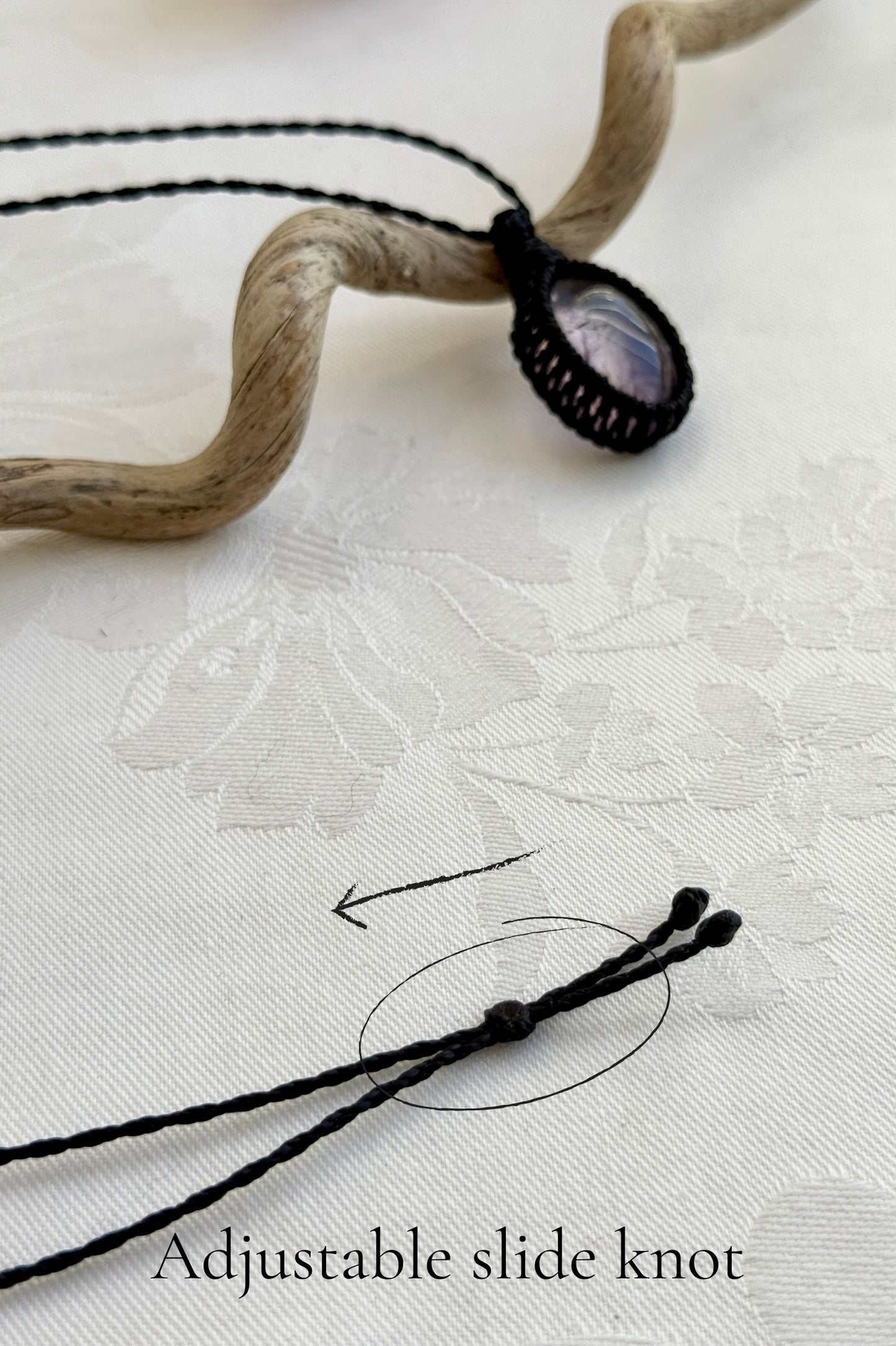 Close-up of the adjustable sliding lock on a handmade Ametrine macrame necklace, ensuring a perfect fit for all sizes.