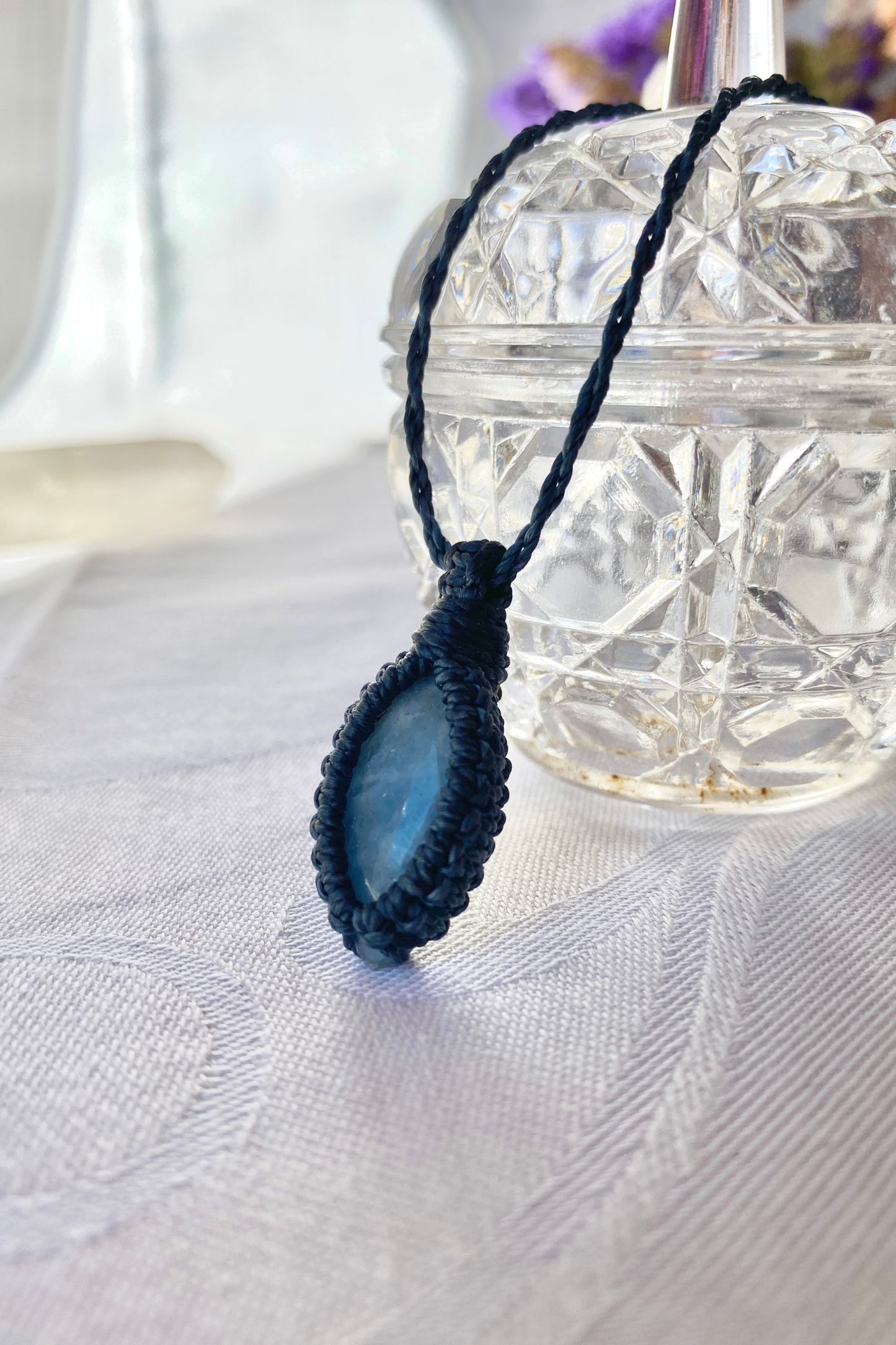 Handmade Aquamarine Macrame necklace featuring a high-quality blue gemstone, side view to showcase its delicate everyday-wear design from the Essence collection.