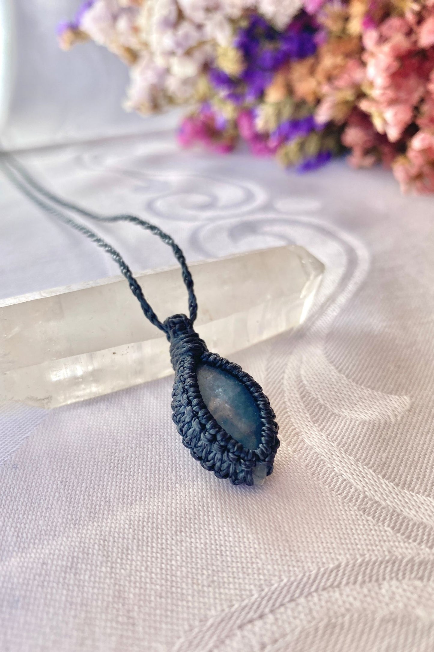 Another side angle shot of the handmade Aquamarine Macrame necklace, emphasizing the elegant craftsmanship and natural gemstone colors.