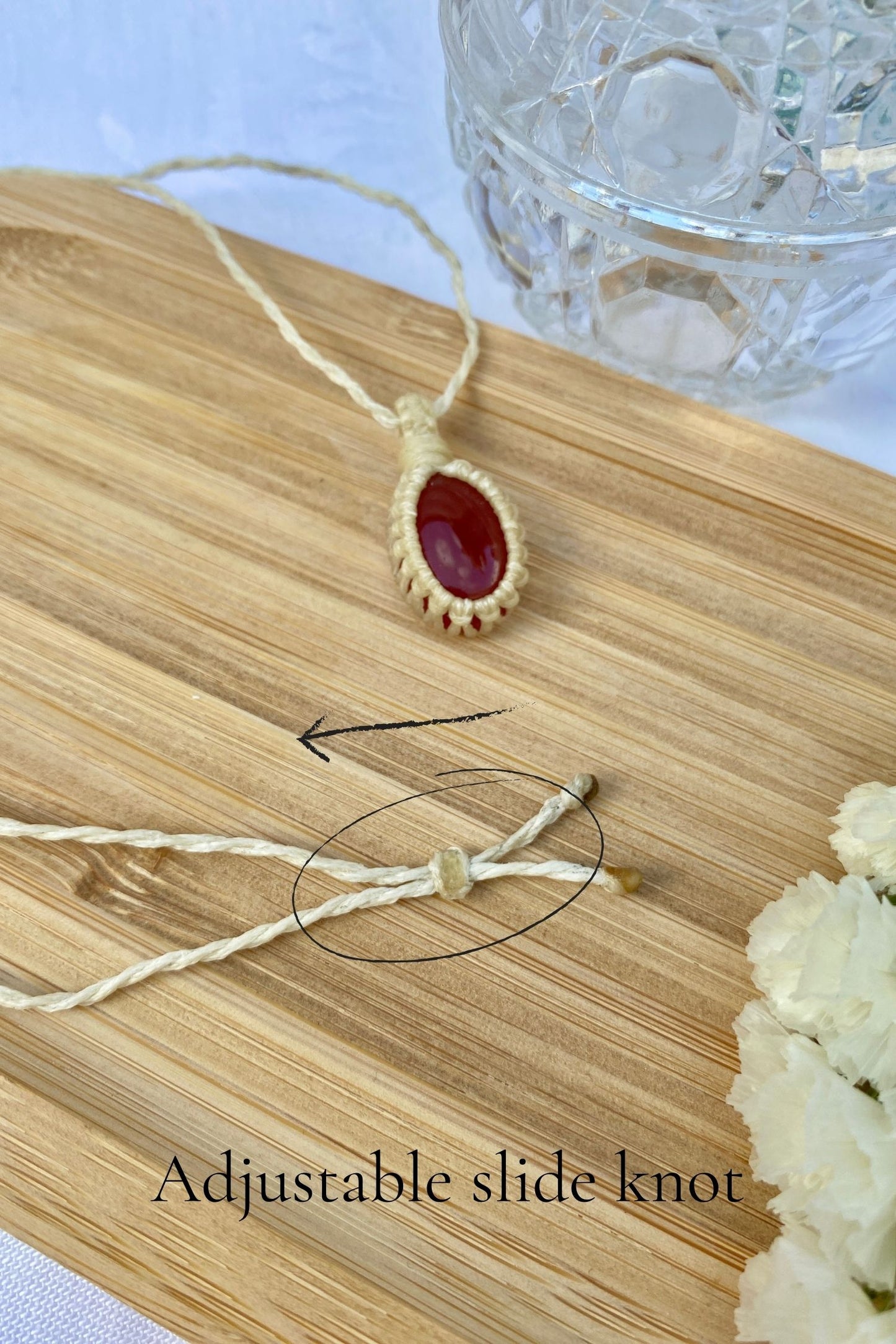Adjustable sliding knot on a handmade Carnelian macrame necklace, offering a comfortable and customizable fit.