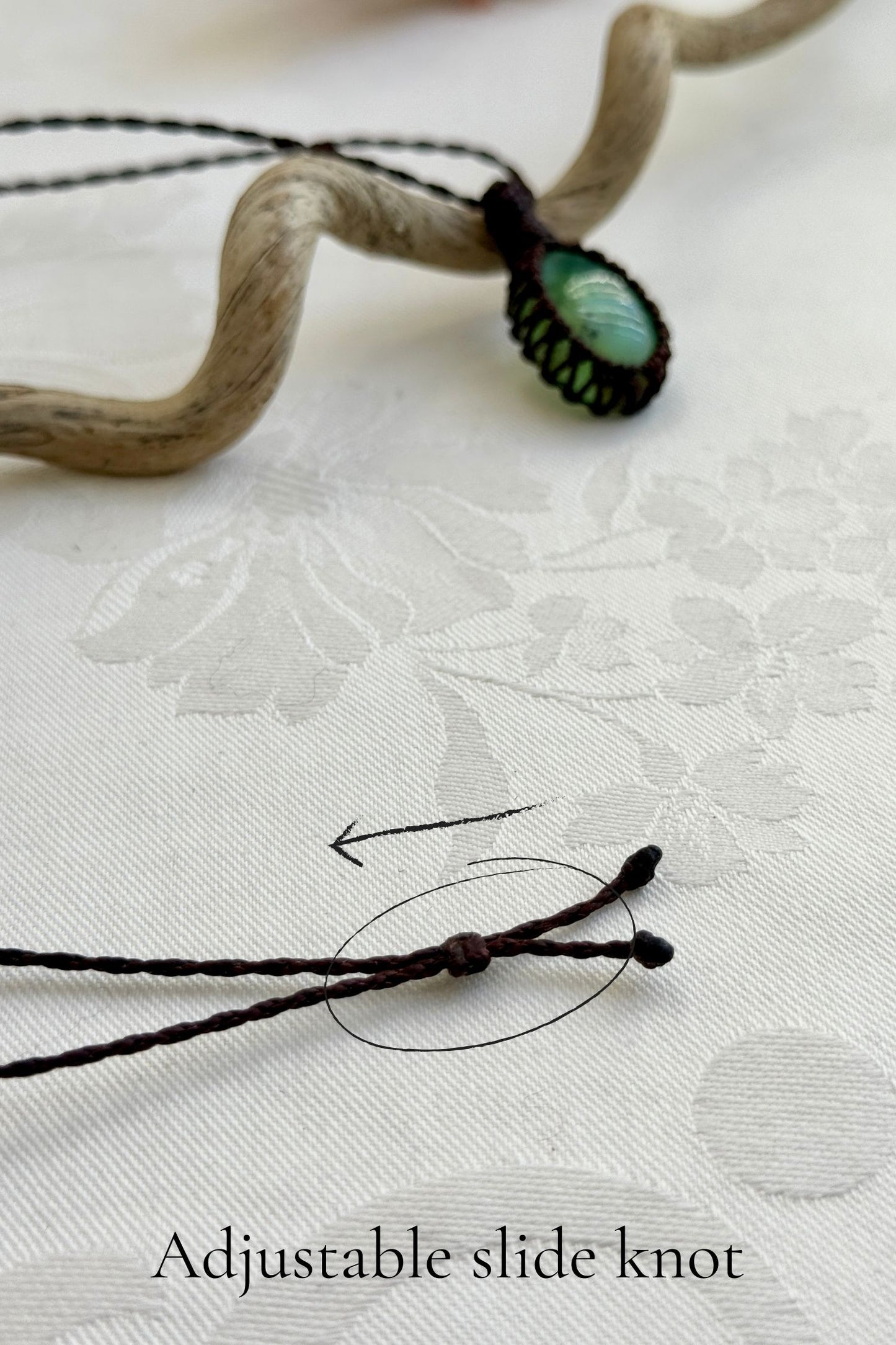 Close-up of the adjustable sliding lock on a handmade Chrysoprase macrame necklace, ensuring a perfect fit for all sizes.