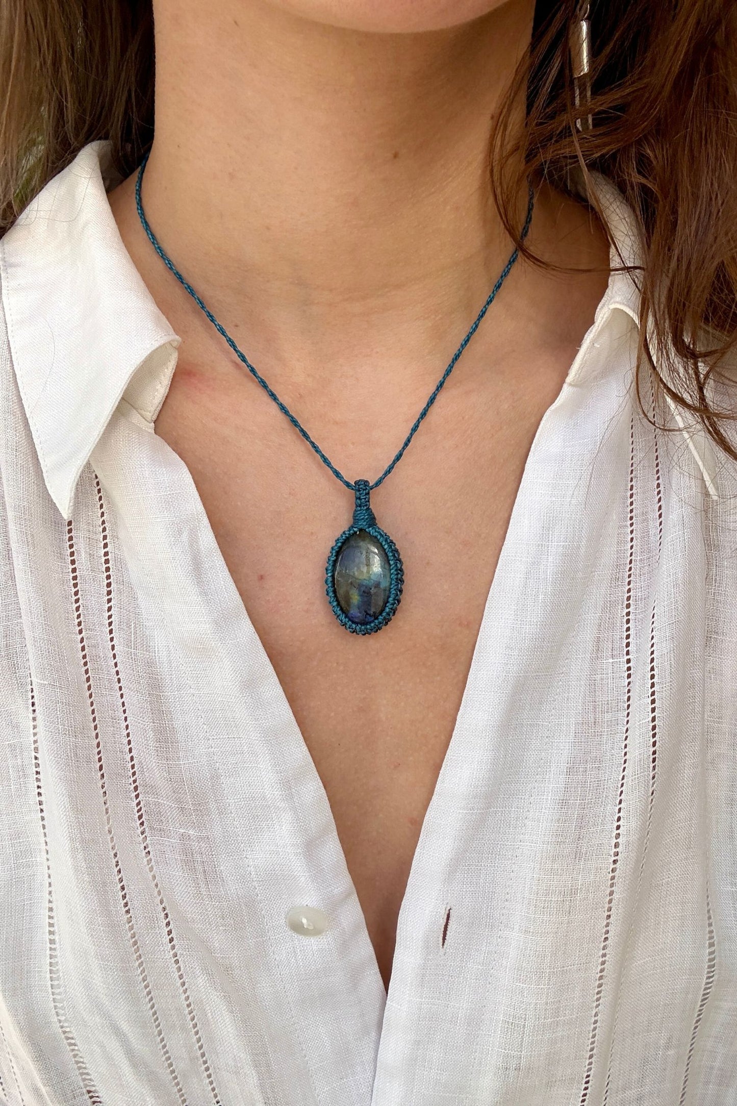 Model wearing a delicate handmade Labradorite macrame necklace with a blue cord, perfect for everyday wear.
