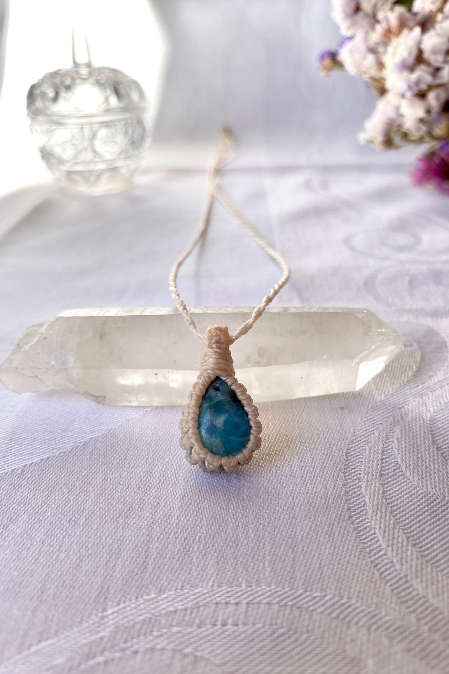 Handmade Larimar Macrame necklace featuring a high-quality blue gemstone, laid flat to showcase its delicate everyday-wear design from the Essence collection.