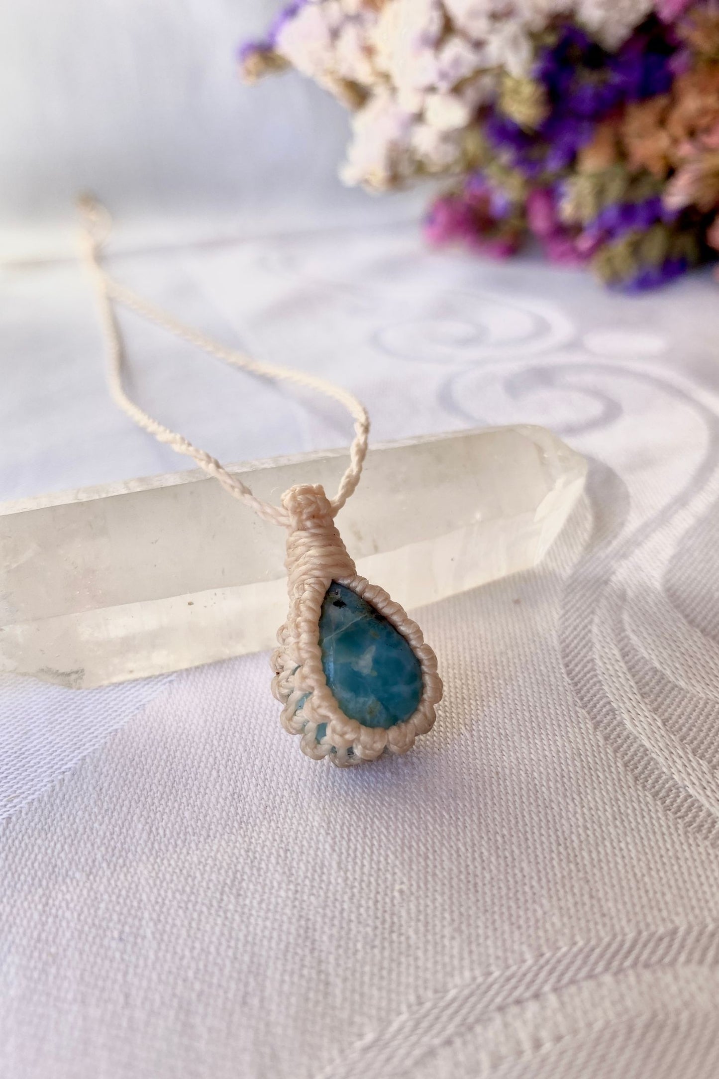 Another side angle shot of the handmade Larimar Macrame necklace, emphasizing the elegant craftsmanship and natural gemstone colors.