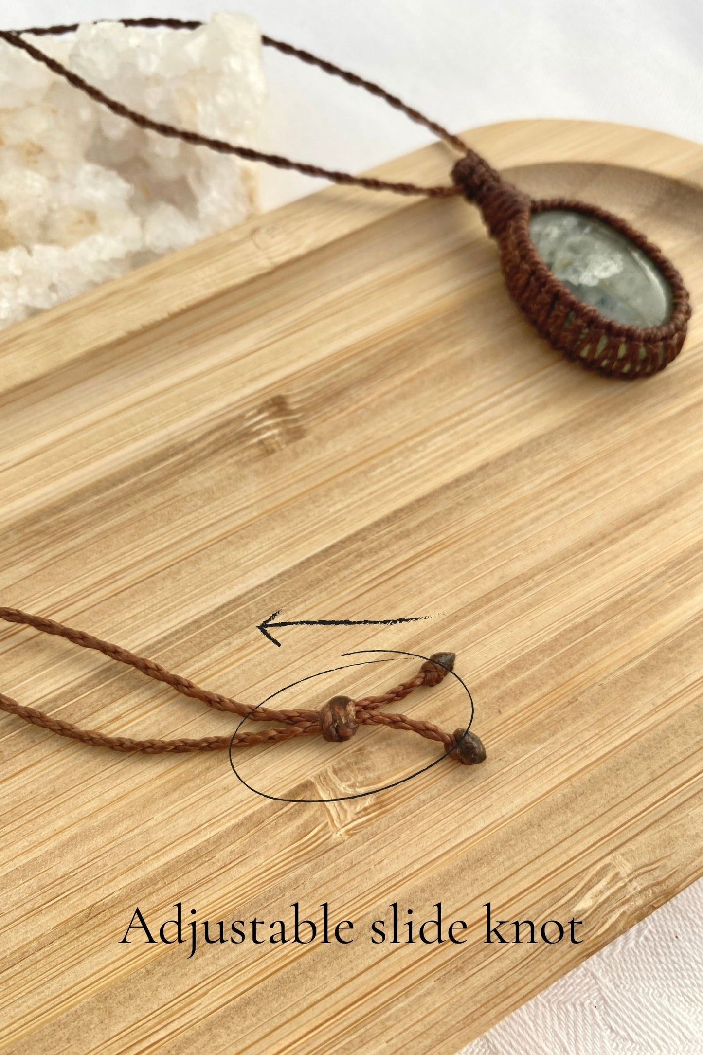 Close-up of the adjustable sliding knot on the Prehnite macrame necklace, allowing for a comfortable, customizable fit.