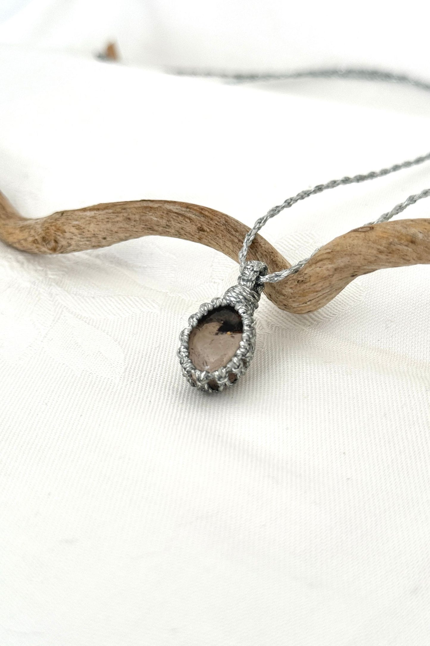 Another side angle shot of the handmade Smoky Quartz Macrame necklace, emphasizing the elegant craftsmanship and natural gemstone colors.