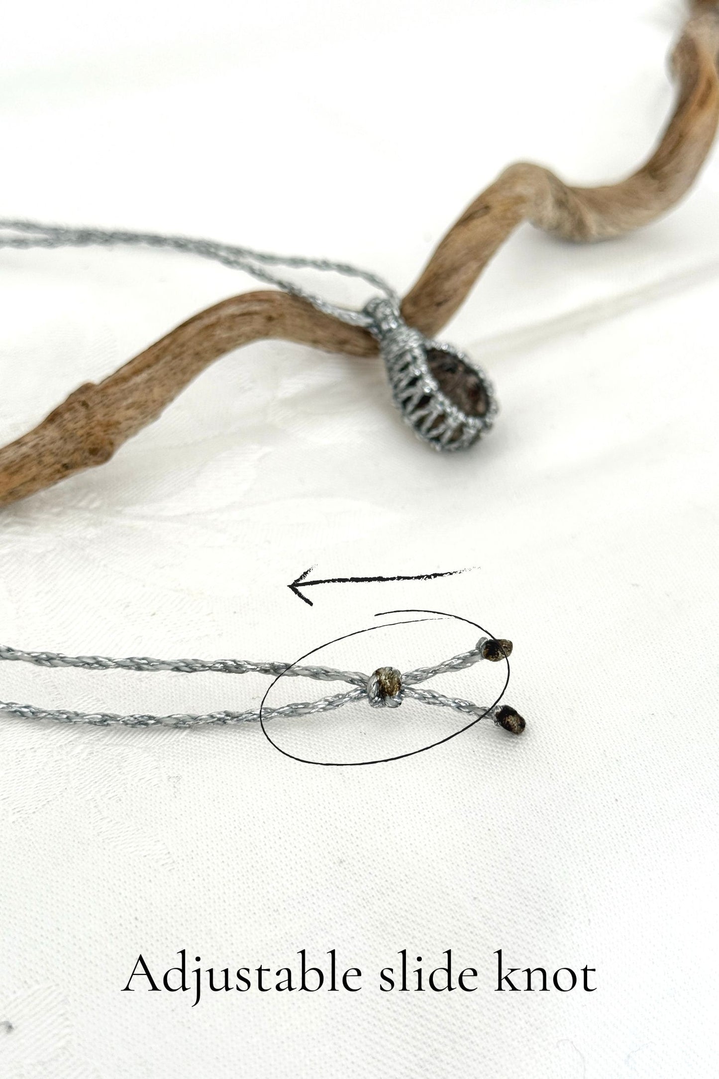 Close-up of the adjustable sliding knot on the Smoky Quartz Macrame necklace, allowing for an easy and customizable fit for any wearer.