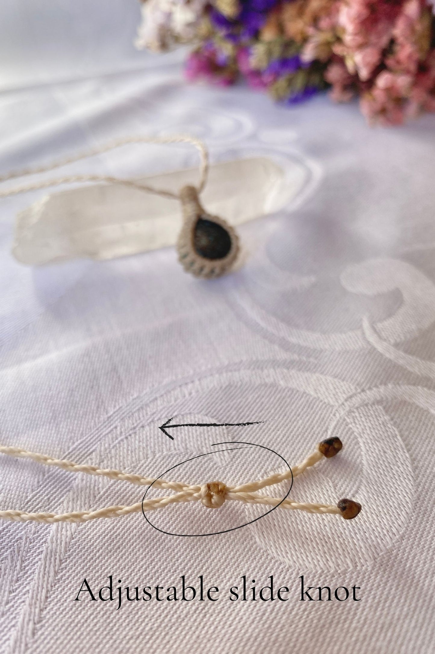 Close-up of the adjustable sliding knot on the Turquoise Macrame necklace, allowing for an easy and customizable fit for any wearer.