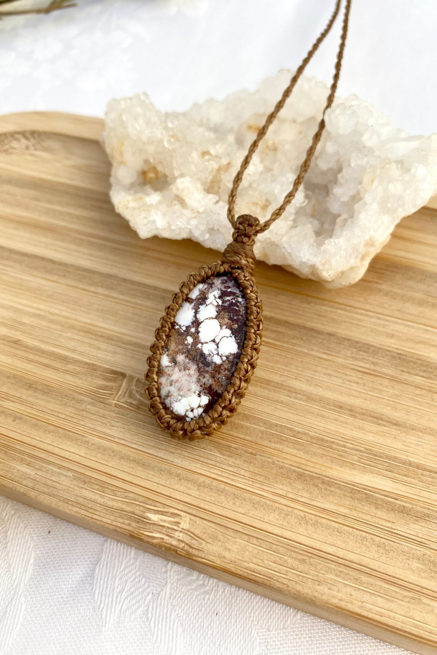 Side angle of a handmade Wild Horse Magnesite macrame necklace, highlighting the gemstone’s detailed patterns and natural beauty.