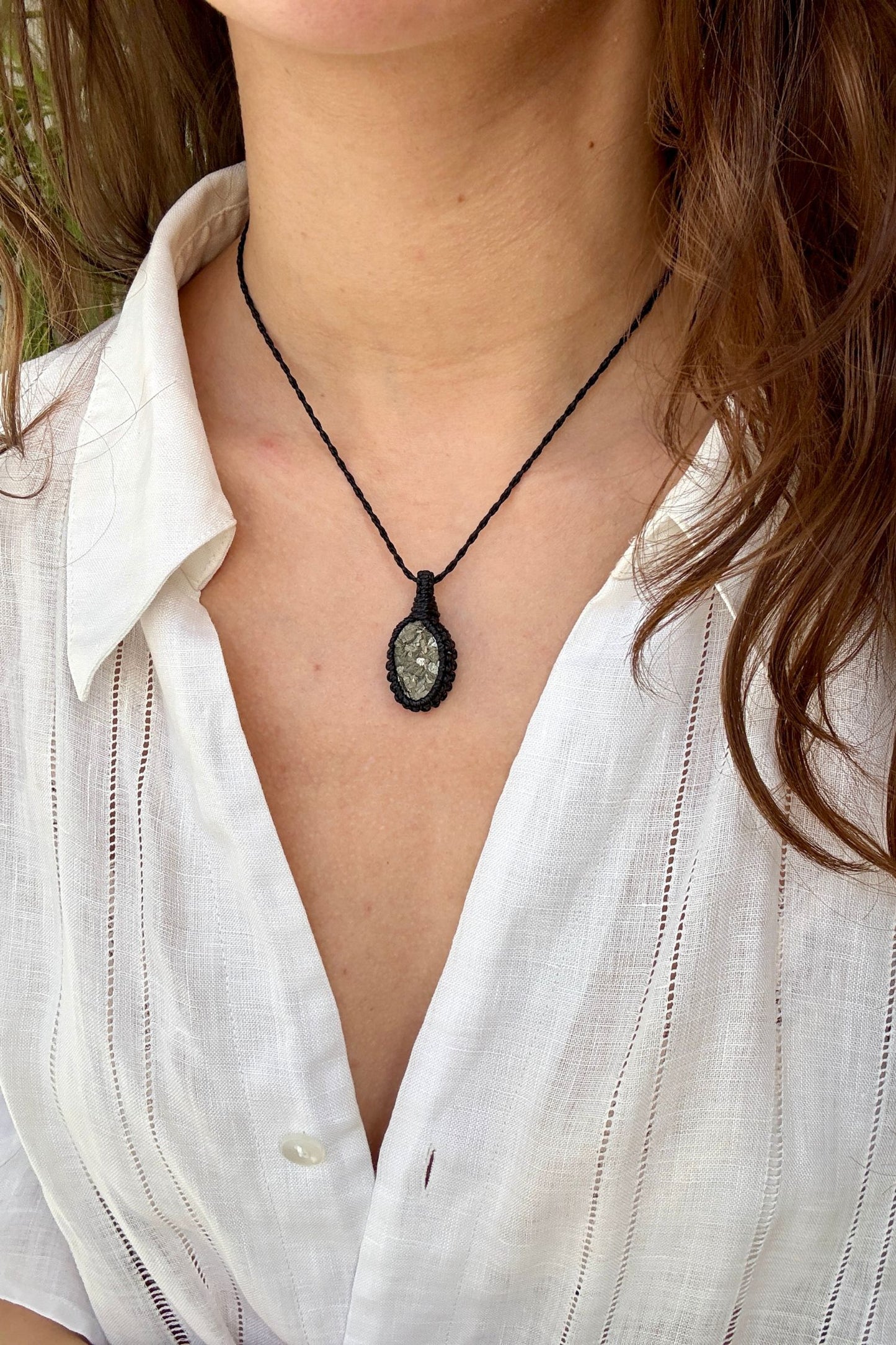 Model wearing a delicate handmade Raw Pyrite macrame necklace with a black cord, perfect for everyday wear.