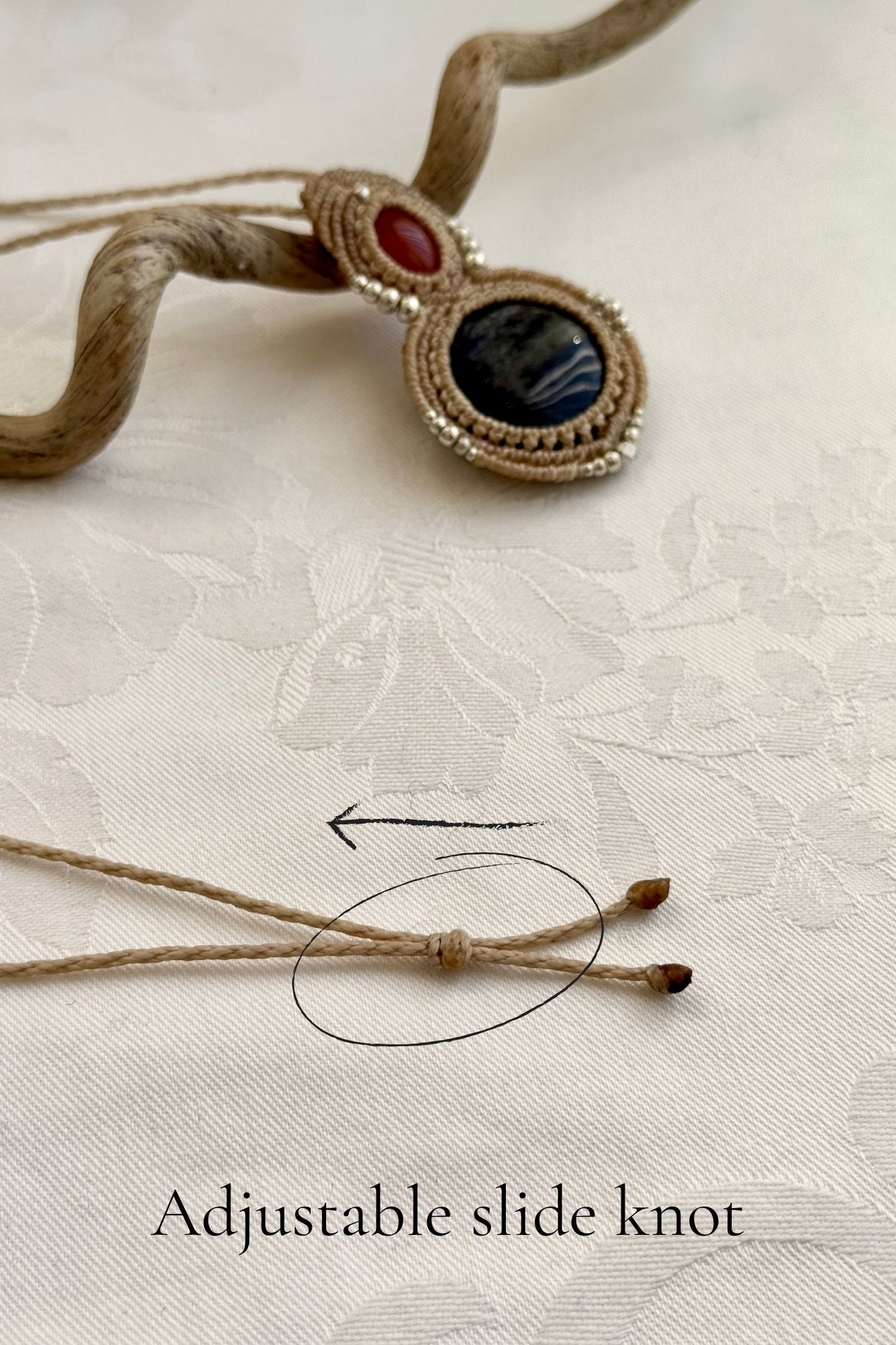 Adjustable handmade macrame necklace with Carnelian and Silver Sheen Obsidian. Featuring a sliding knot closure for a customizable fit.