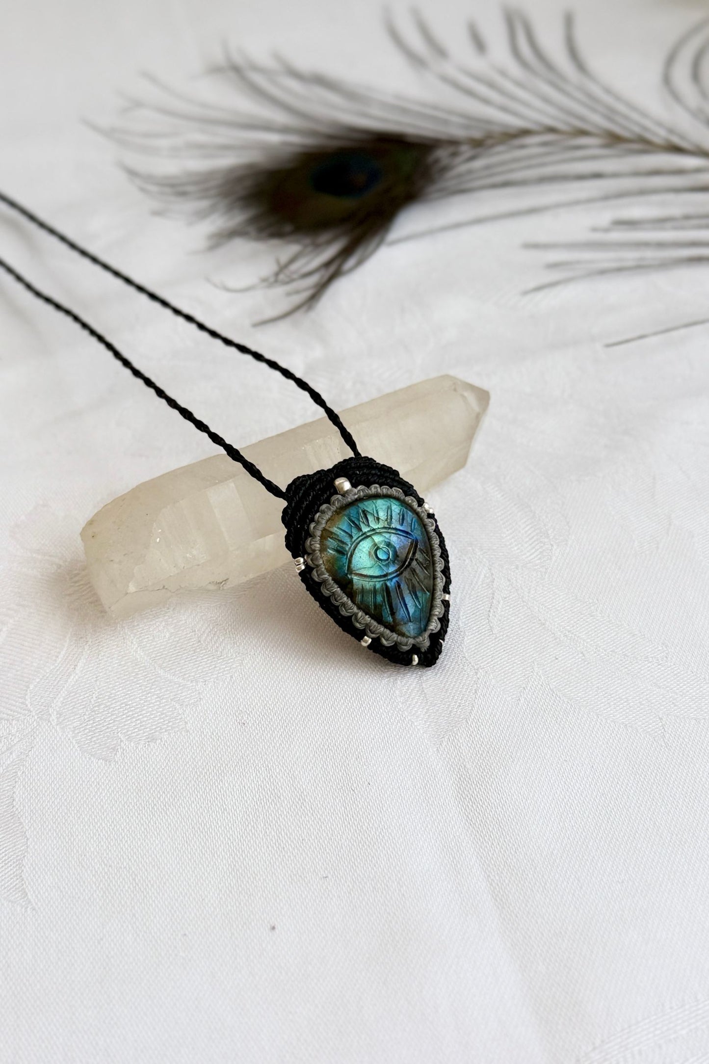 Artisan Labradorite protective eye necklace, shown from another angle to capture gemstone unique blue hues.