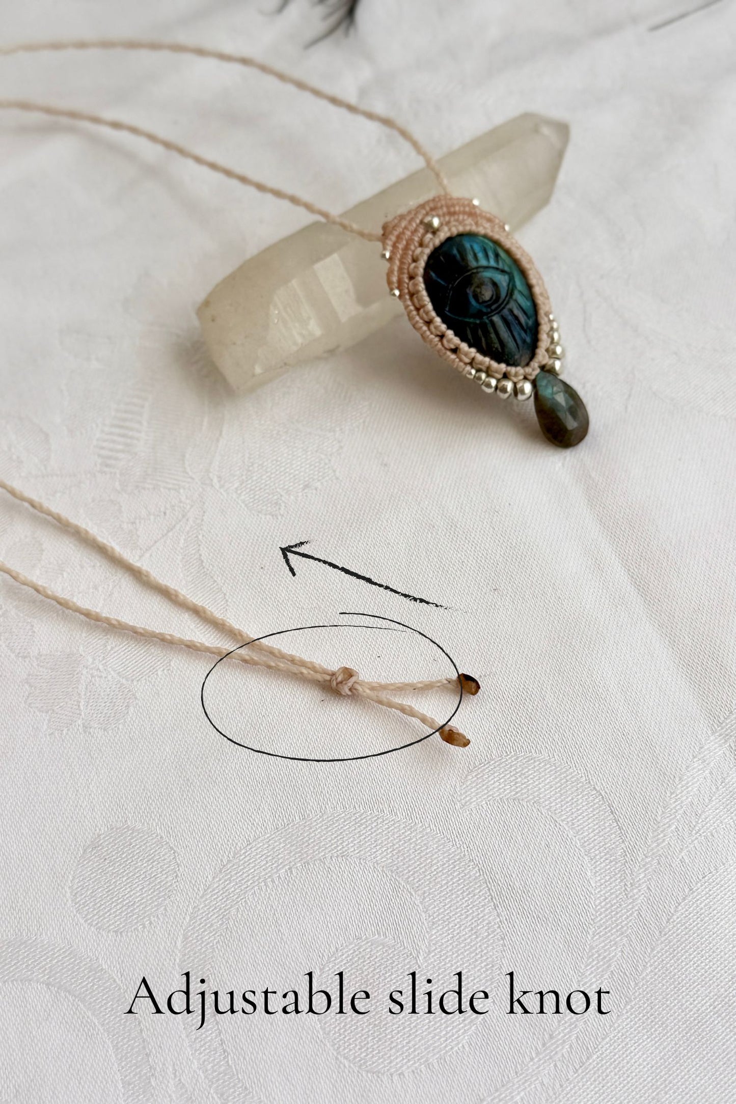 Adjustable sliding knot closure on handmade Labradorite necklace, showing versatile and comfortable fit.