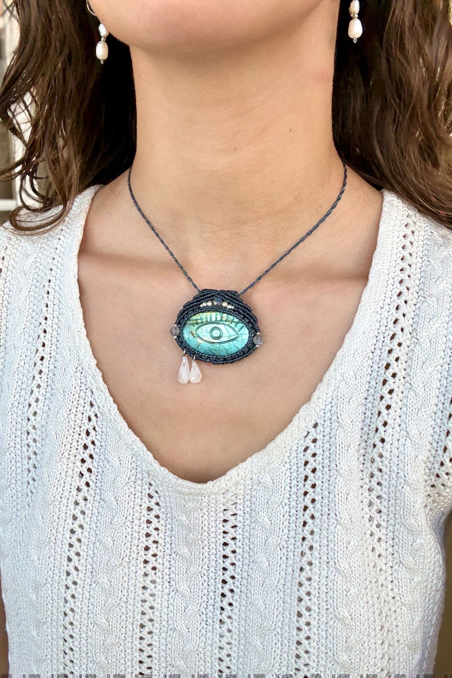 Model wearing handmade Labradorite protective eye necklace, showing how the jewelry can be styled.
