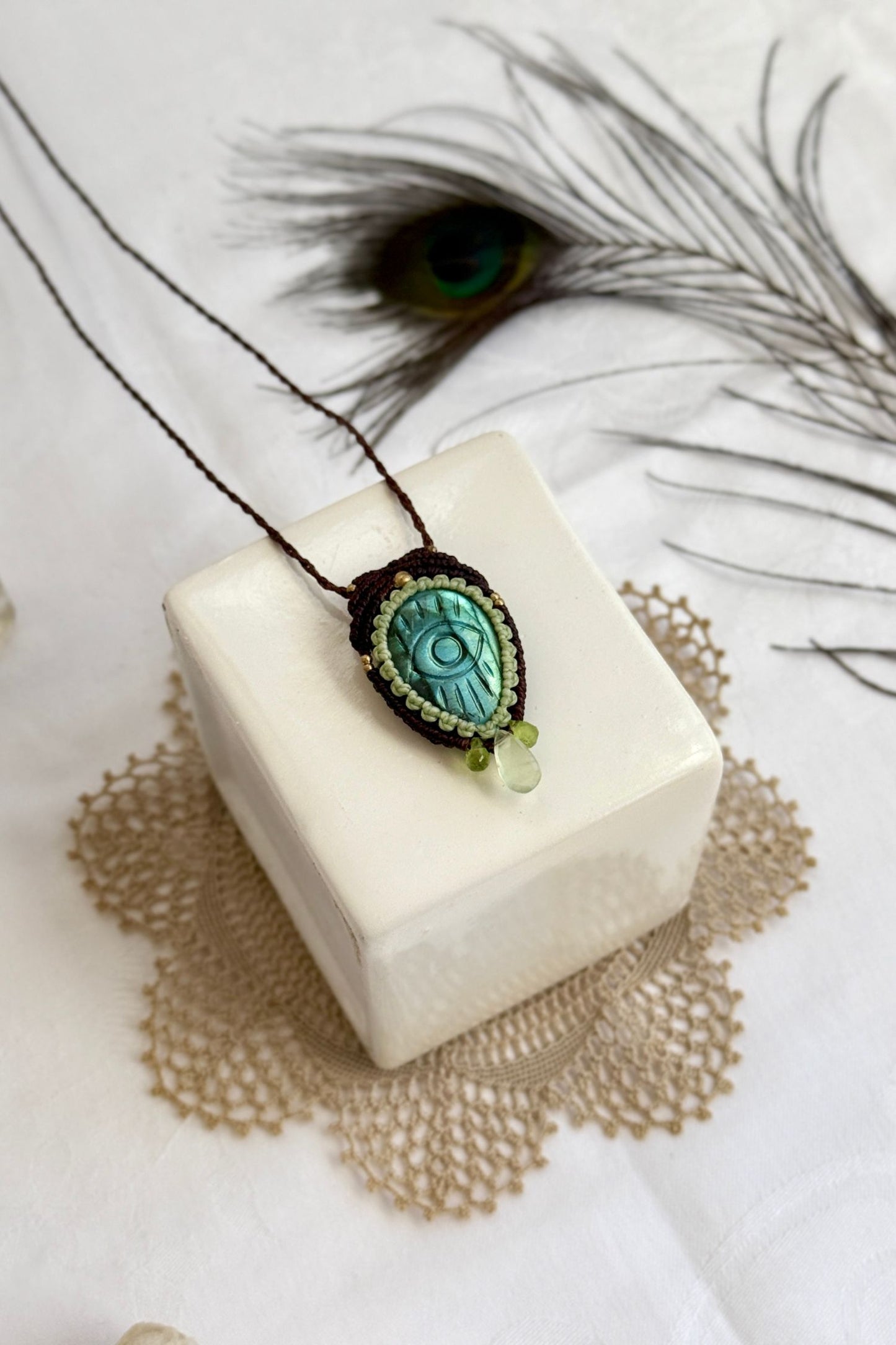 Handmade macrame necklace with Labradorite protective eye pendant, displayed flat to reveal gemstone’s natural labradorescence.
