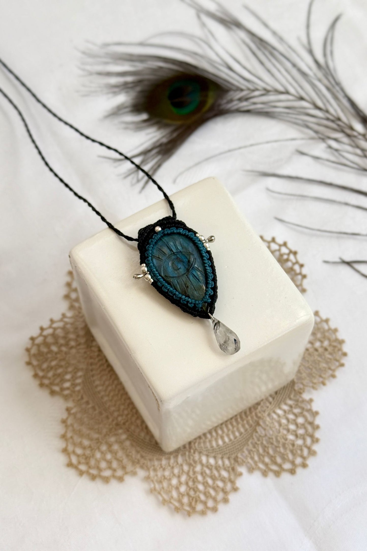 Handmade macrame necklace with Labradorite protective eye pendant, displayed flat to reveal gemstone’s natural labradorescence.