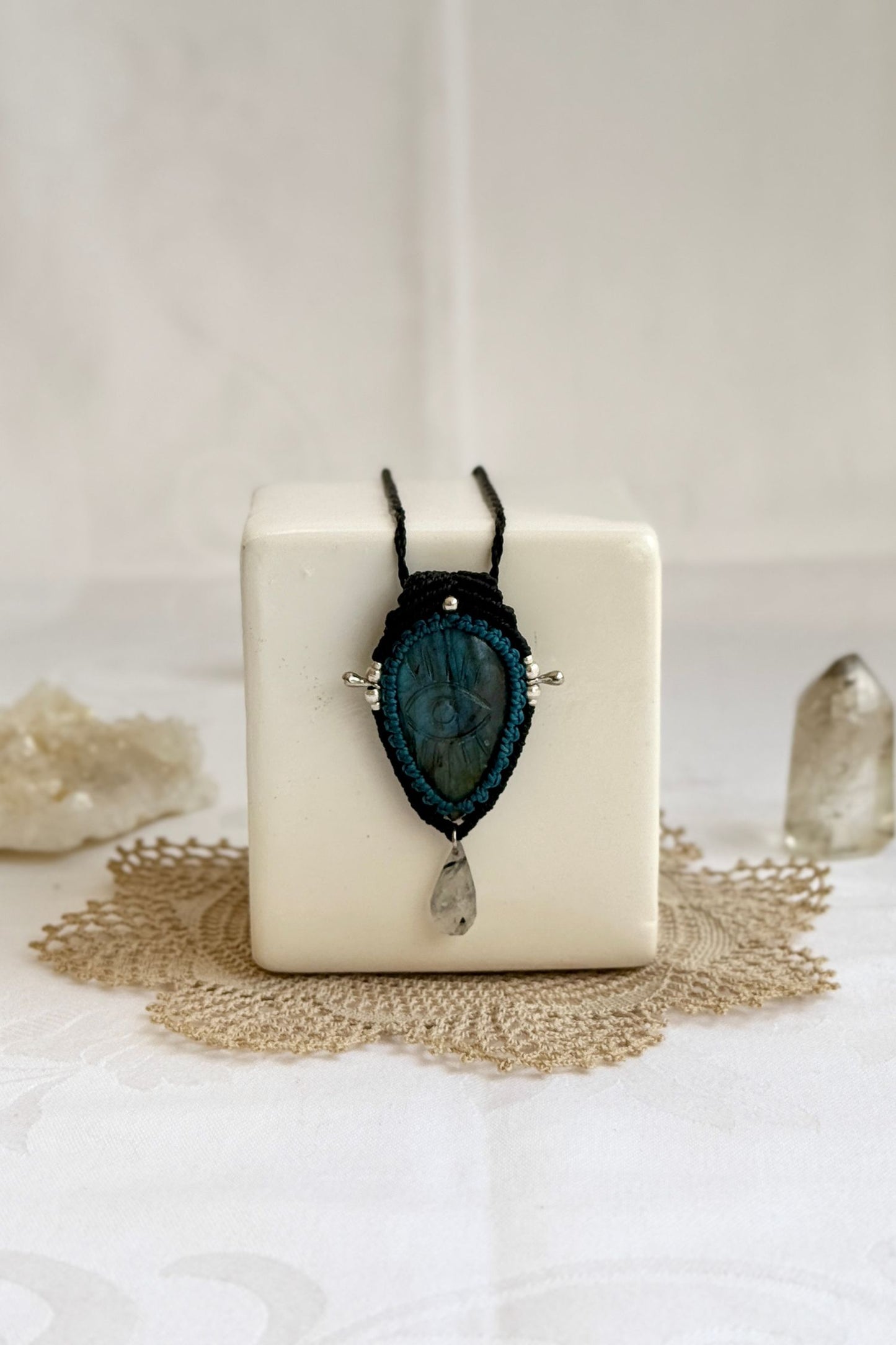 Artisan Labradorite protective eye necklace, shown from another angle to capture the gemstone contrast with the macrame color threads.