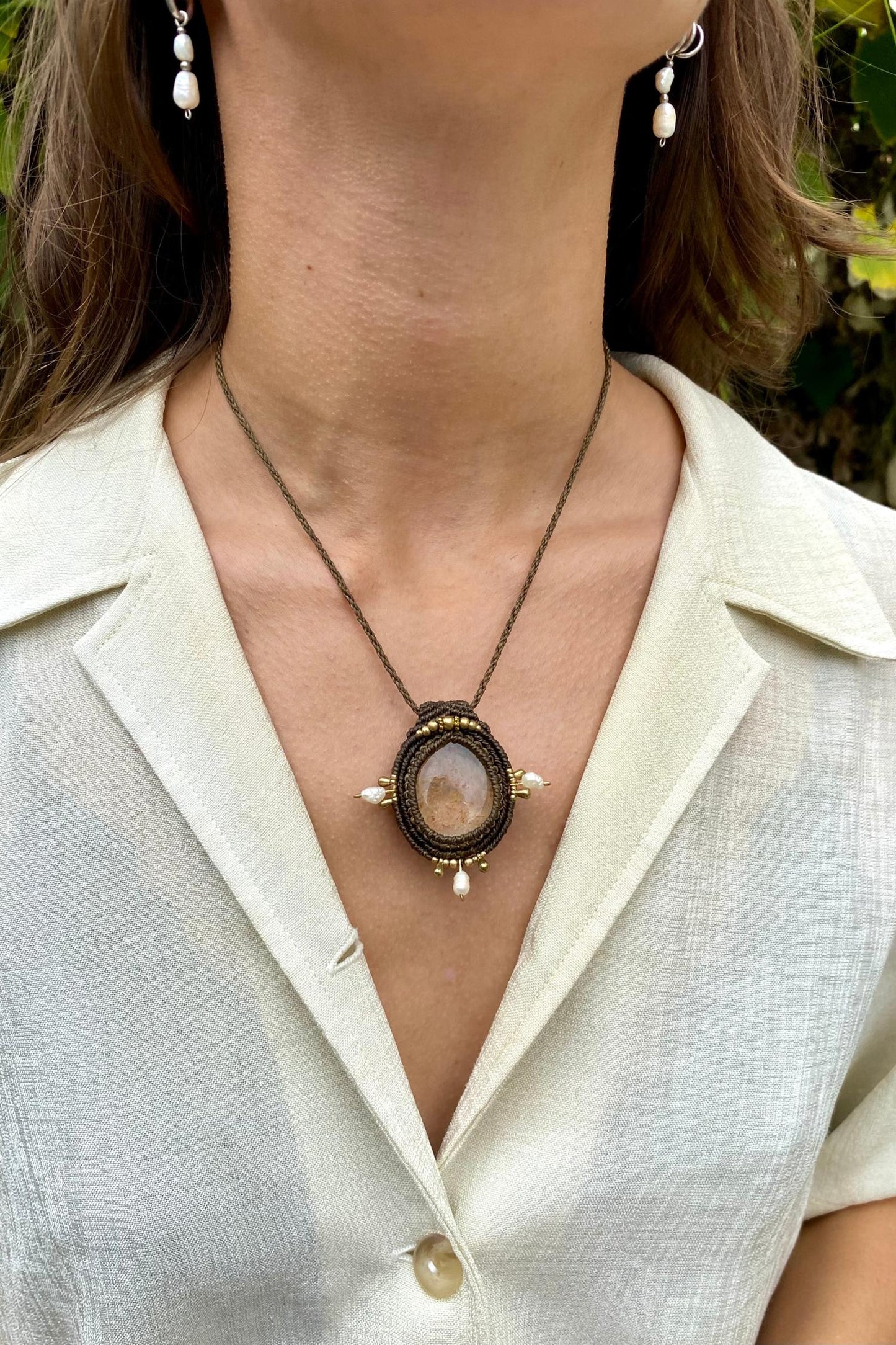 Handmade gemstone necklace worn, showing how the unique Lodolite and Fresh Water Pearls pendant elegantly rests on the neckline.