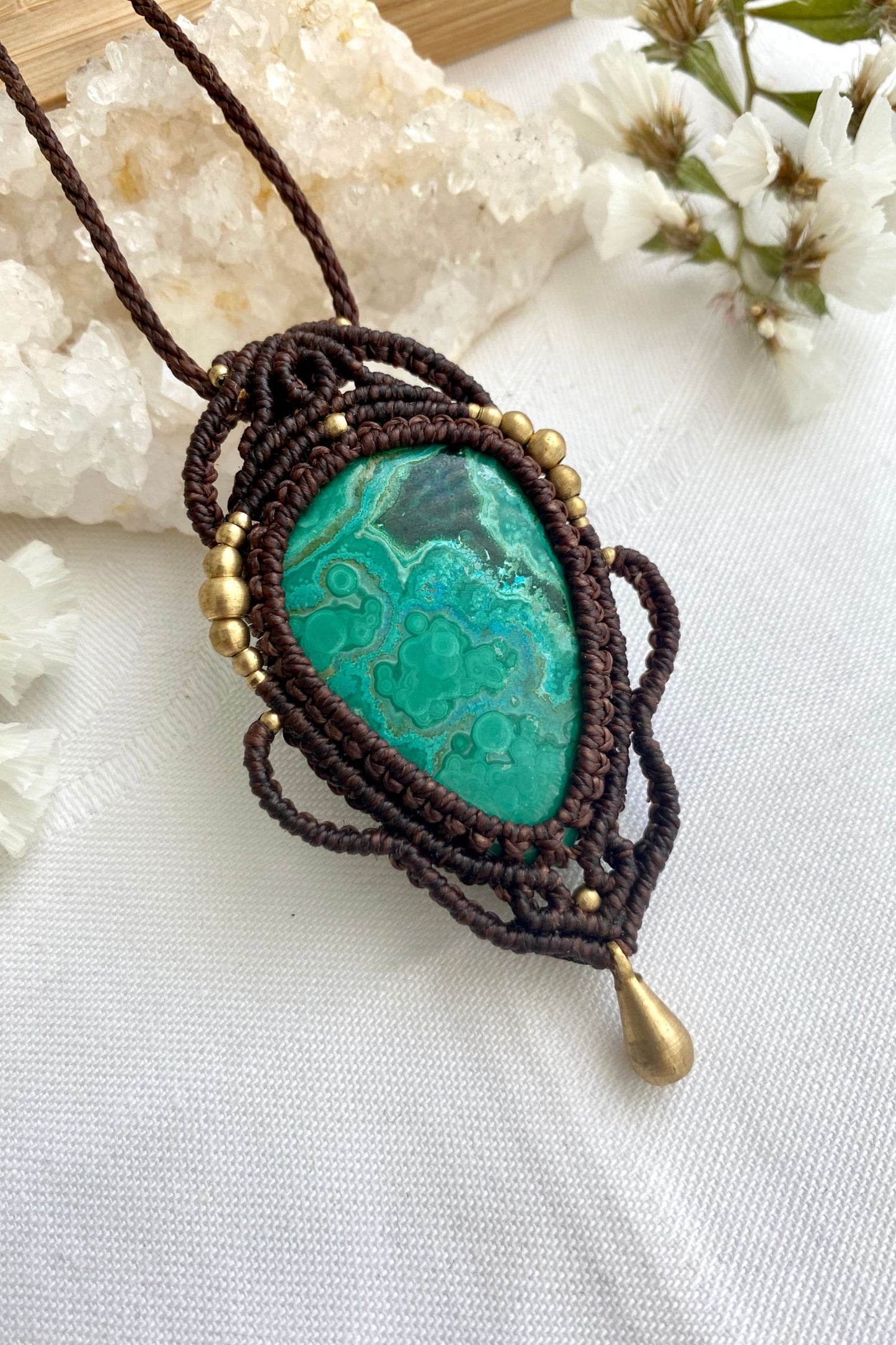 Side angle of the handcrafted macrame necklace, highlighting the detailed craftsmanship and the rich colors of Malachite with Chrysocolla gemstone.