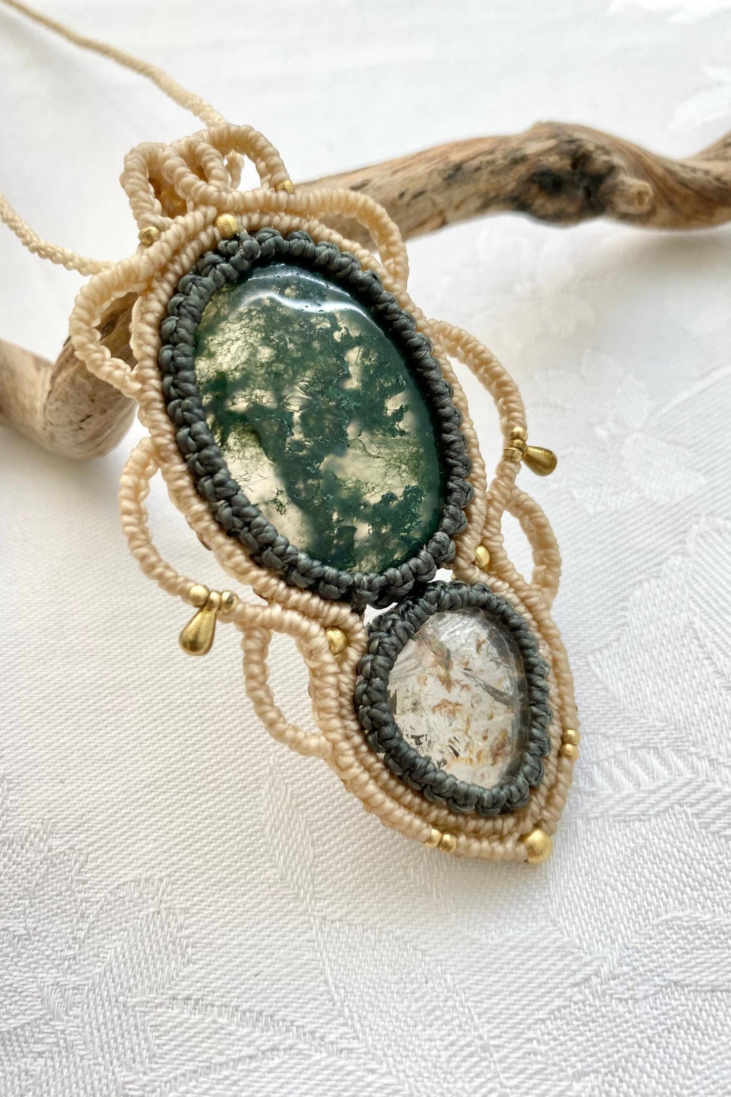 Side angle of the handcrafted macrame necklace, highlighting the detailed craftsmanship and the rich colors of Moss Agate and Lodolite gemstones.