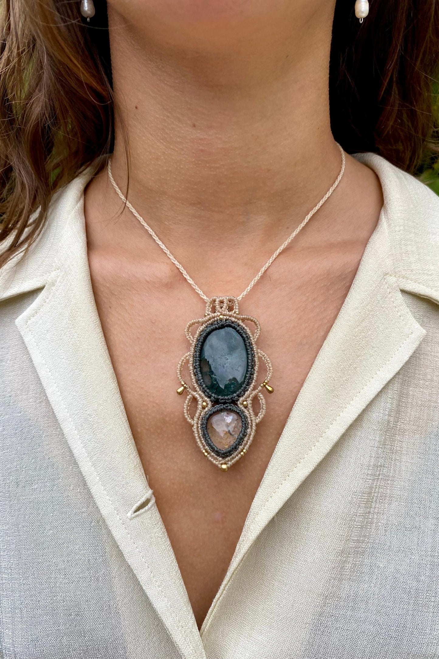 Handmade gemstone necklace worn, showing how the unique Moss Agate and Lodolite pendant elegantly rests on the neckline.