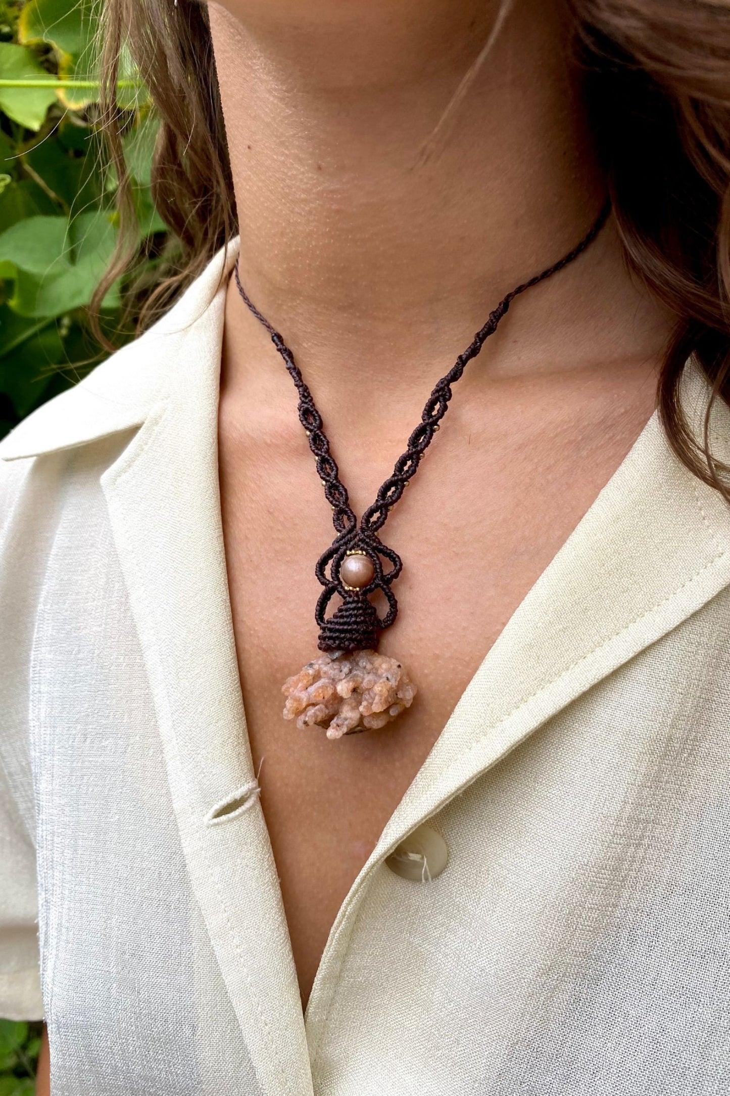 Handmade gemstone necklace worn, showing how the unique Raw Chalcedony and Peach Moonstone pendant elegantly rests on the neckline.