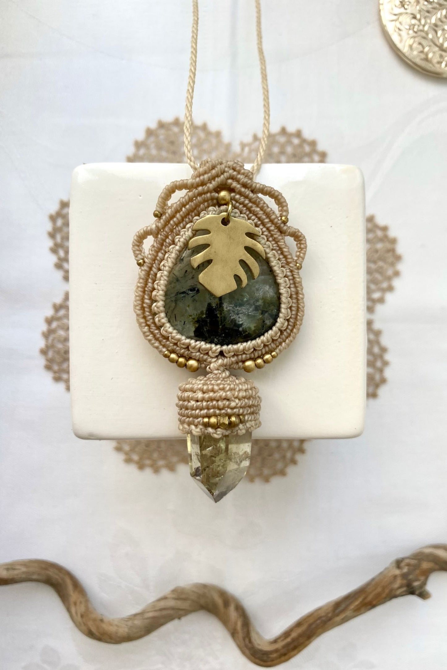 Detailed view of the handmade necklace, highlighting the raw textures of natural Prehnite and Raw Smoky Quartz Point gemstones in a distinctive, statement-making design.