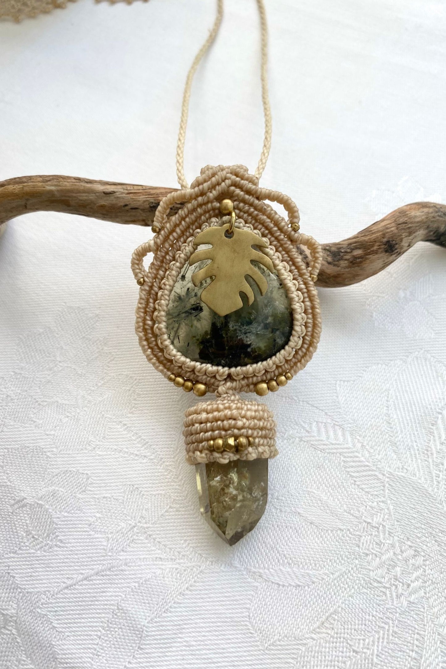 A close-up of the handmade gemstone necklace, showcasing the natural beauty of Prehnite and Raw Smoky Quartz Point in an exclusive, one-of-a-kind design.