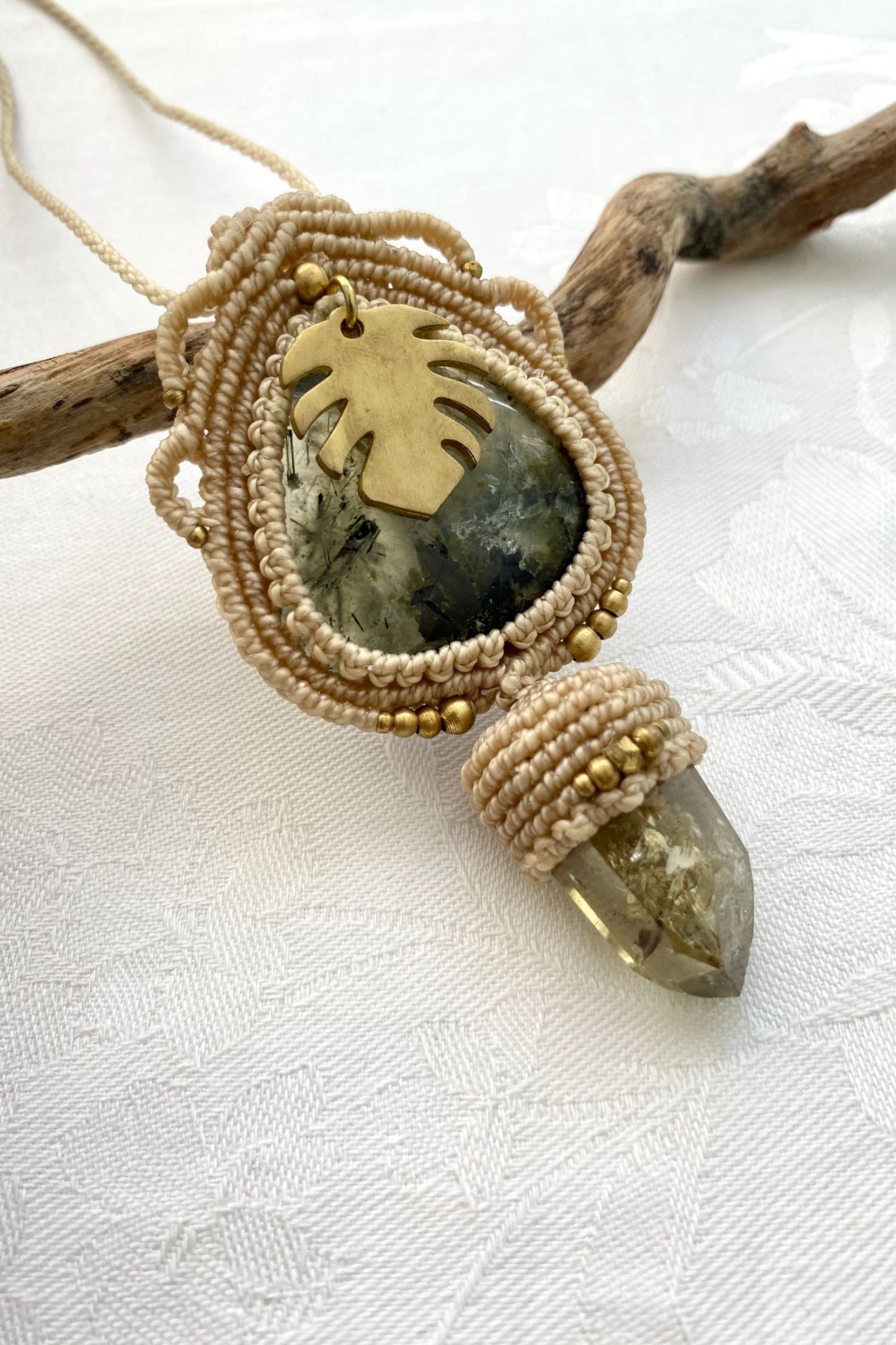 Side angle of the handcrafted macrame necklace, highlighting the detailed craftsmanship and the rich colors of Prehnite and Raw Smoky Quartz Point gemstones.
