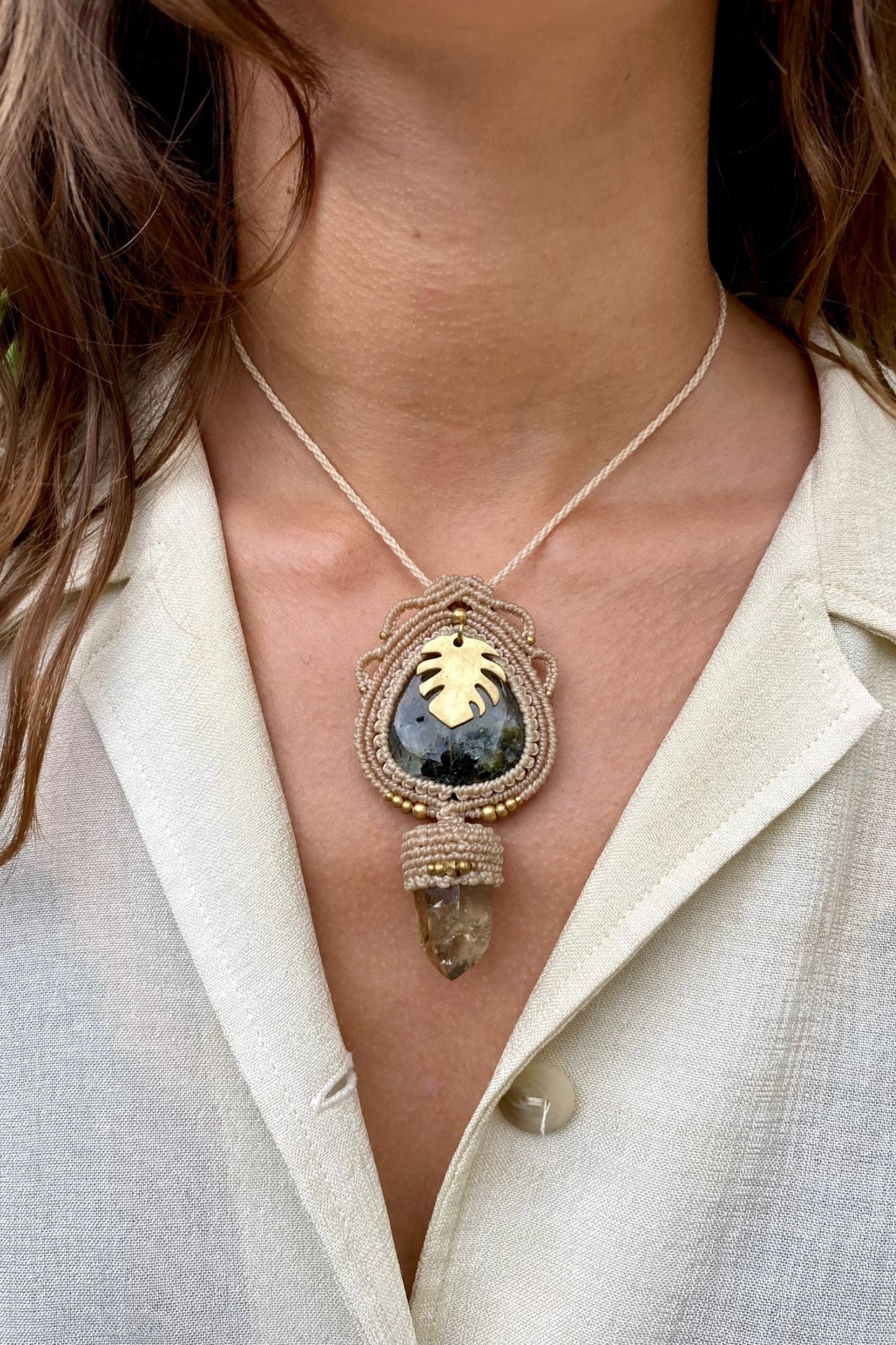 Handmade gemstone necklace worn, showing how the unique Prehnite and Raw Smoky Quartz Point pendant elegantly rests on the neckline.