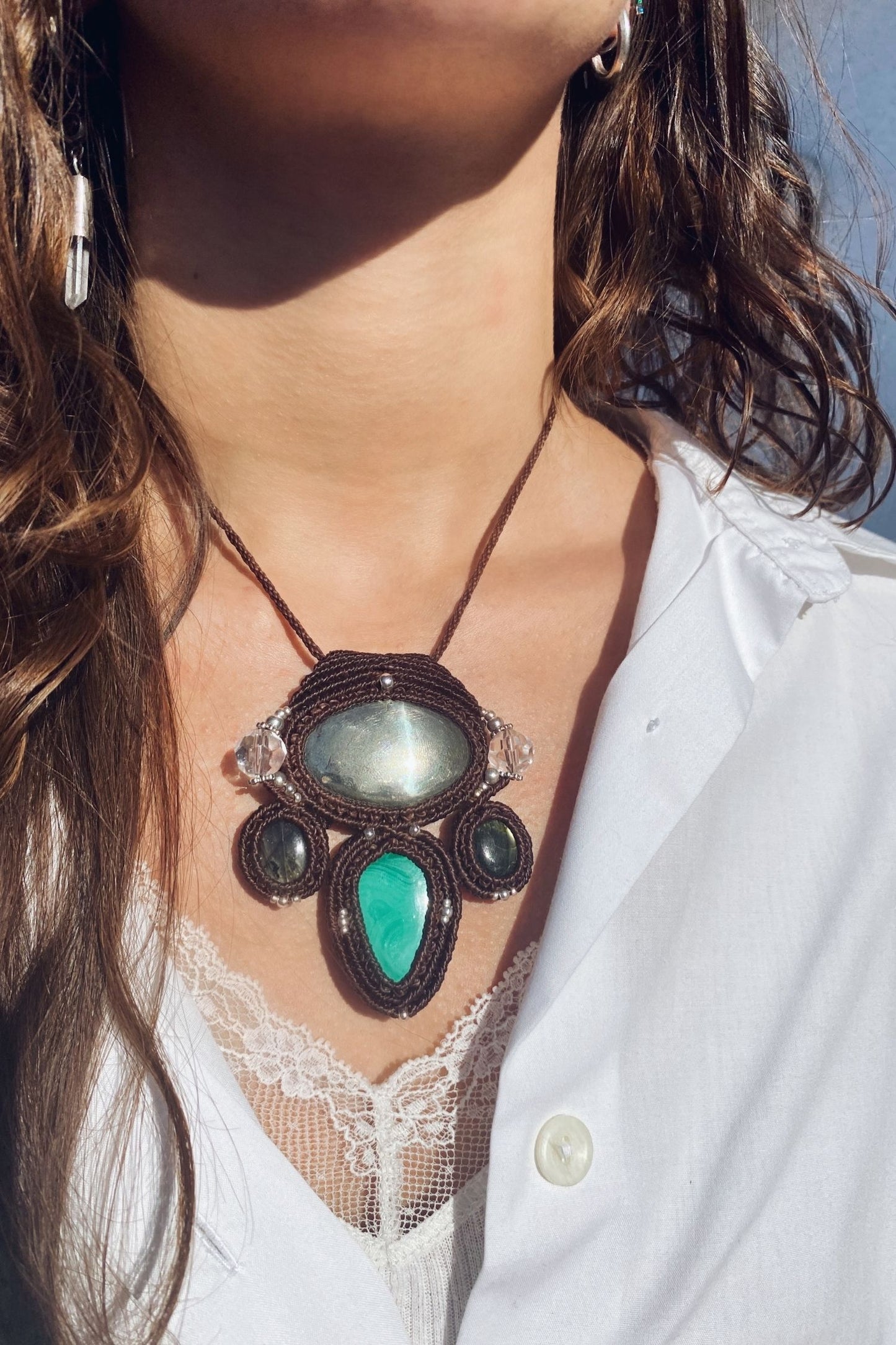 Handmade gemstone necklace worn, showing how the unique Pyrite and Malachite pendant elegantly rests on the neckline.