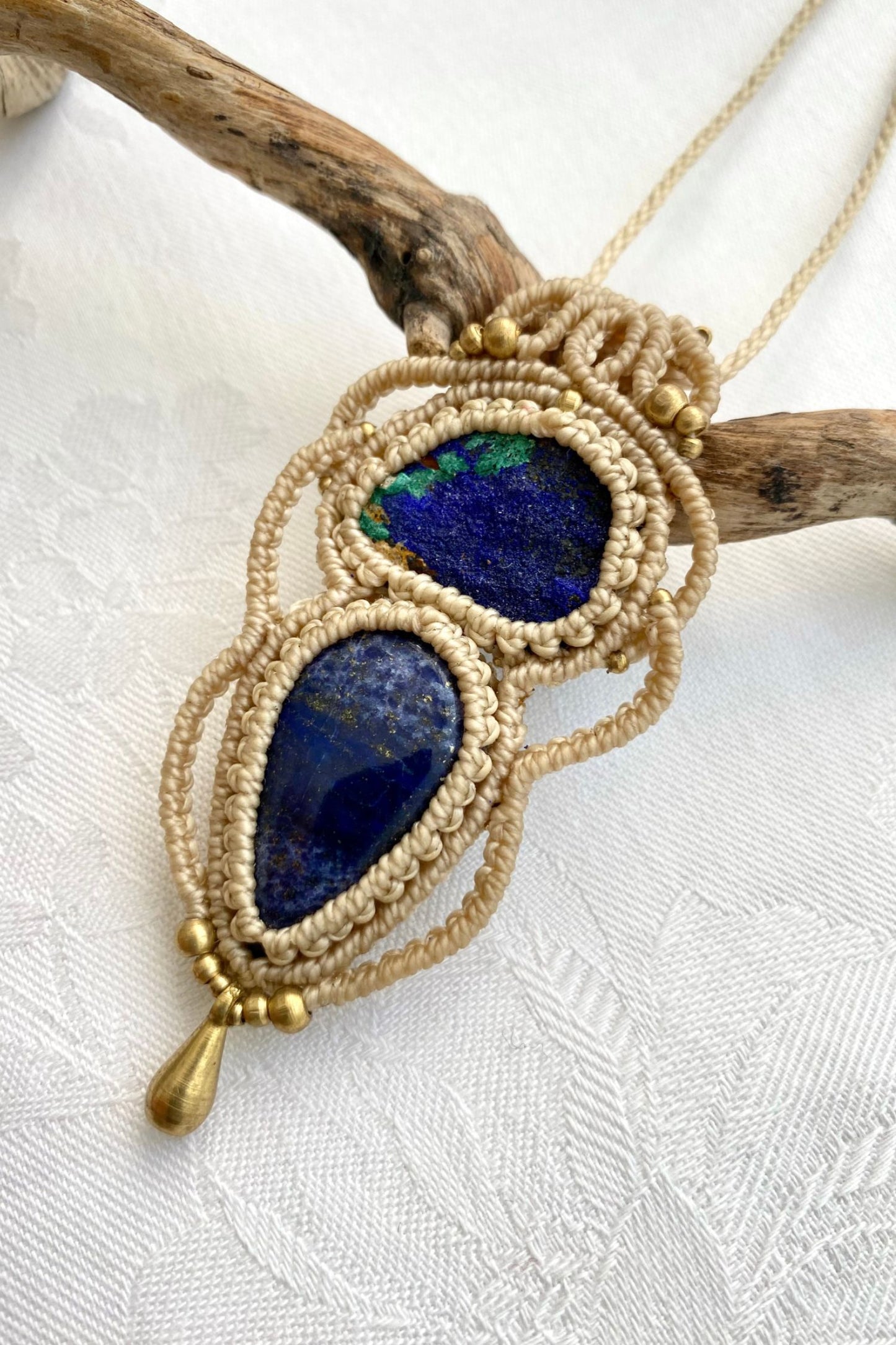 Side angle of the handcrafted macrame necklace, highlighting the detailed craftsmanship and the rich colors of Raw Azurite and Lapis Lazuli gemstones.