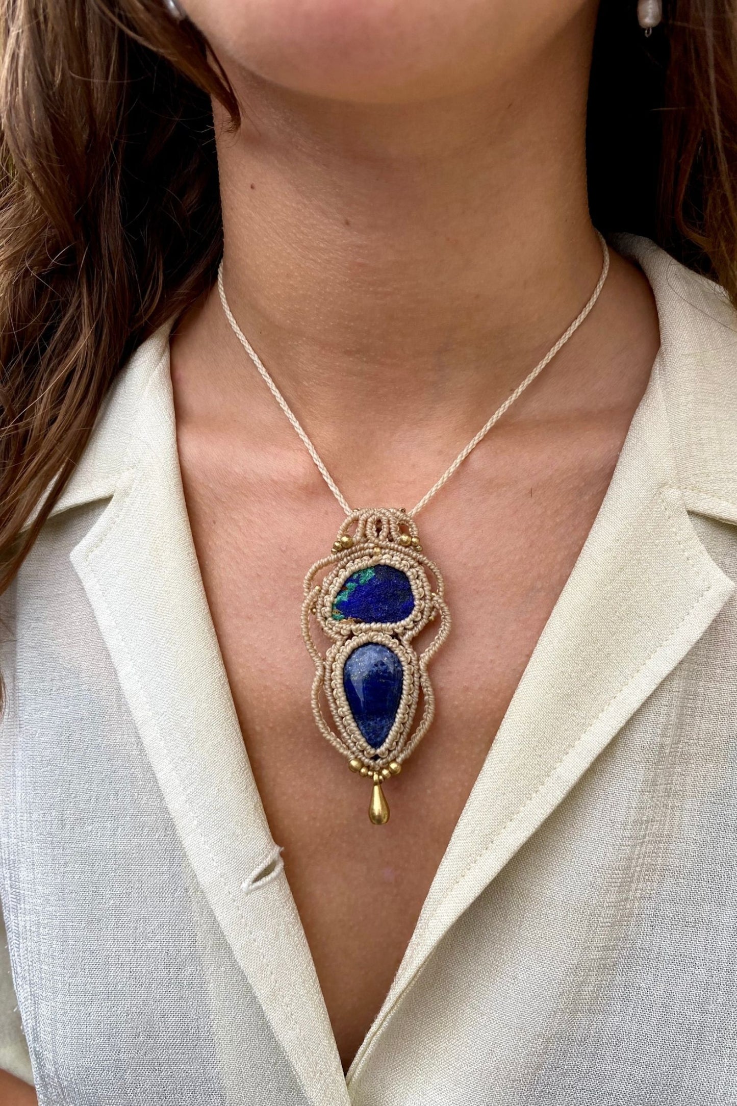 Handmade gemstone necklace worn, showing how the unique Raw Azurite and Lapis Lazuli pendant elegantly rests on the neckline.