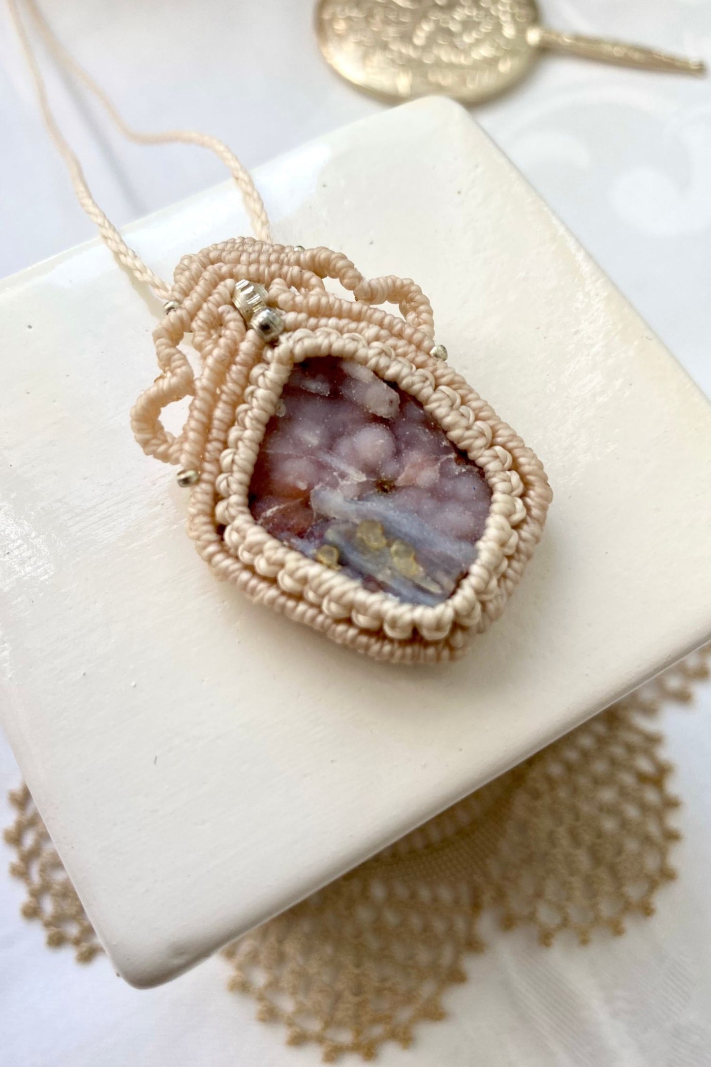 Detailed view of the handmade necklace, highlighting the raw textures of natural Raw Pink Chalcedony Stalactite gemstone in a distinctive, statement-making design.