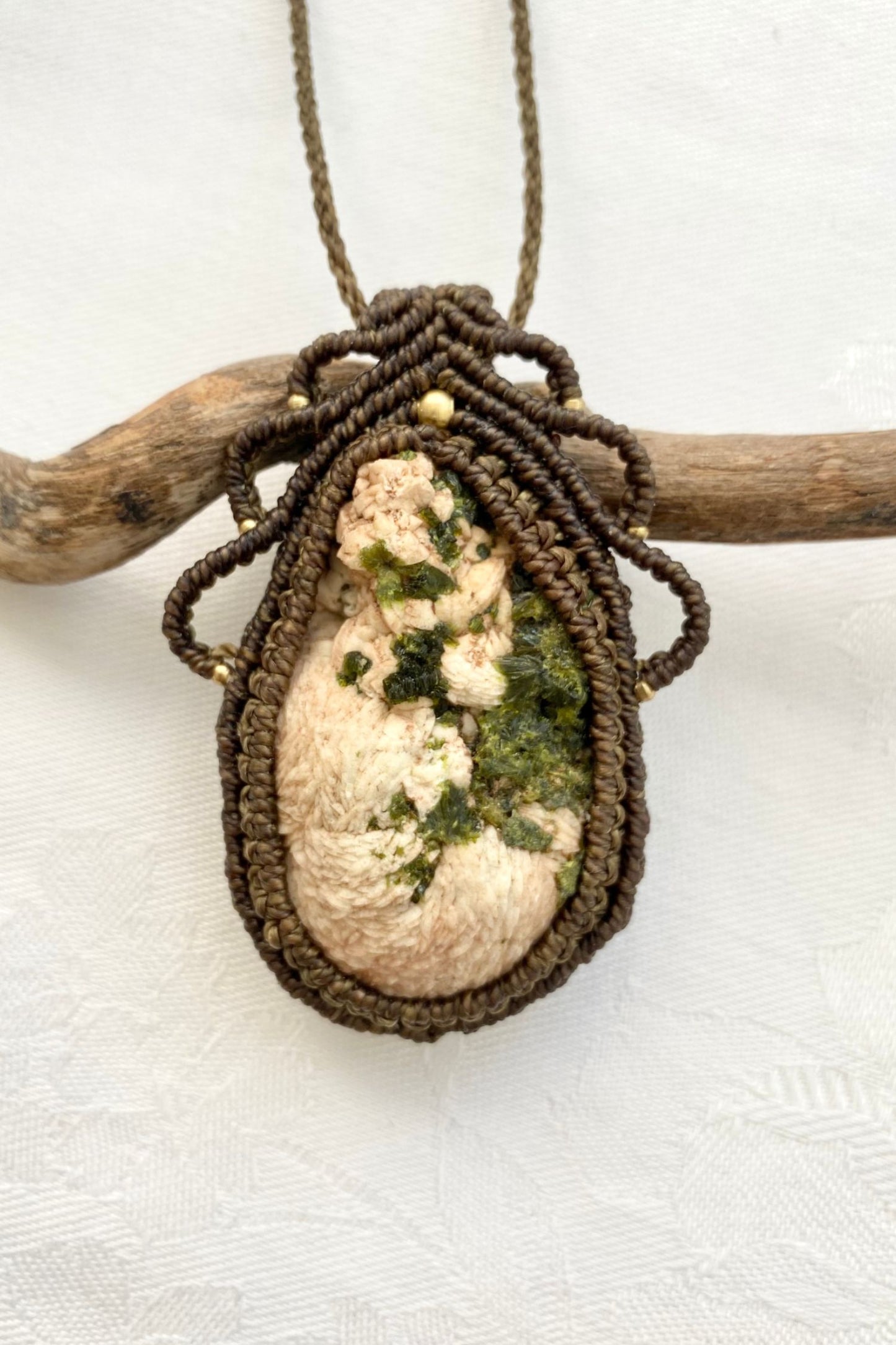 A close-up of the handmade gemstone necklace, showcasing the natural beauty of Prehnite and Epidote in an exclusive, one-of-a-kind design.