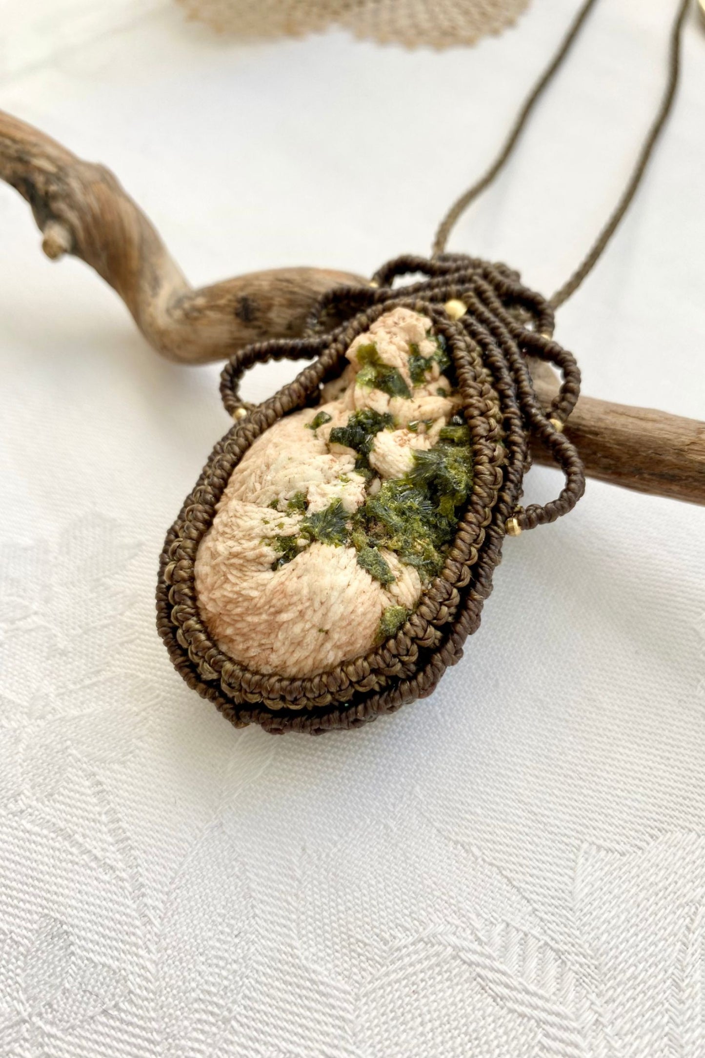 Side angle of the handcrafted macrame necklace, highlighting the detailed craftsmanship and the rich colors of Prehnite and Epidote gemstone.