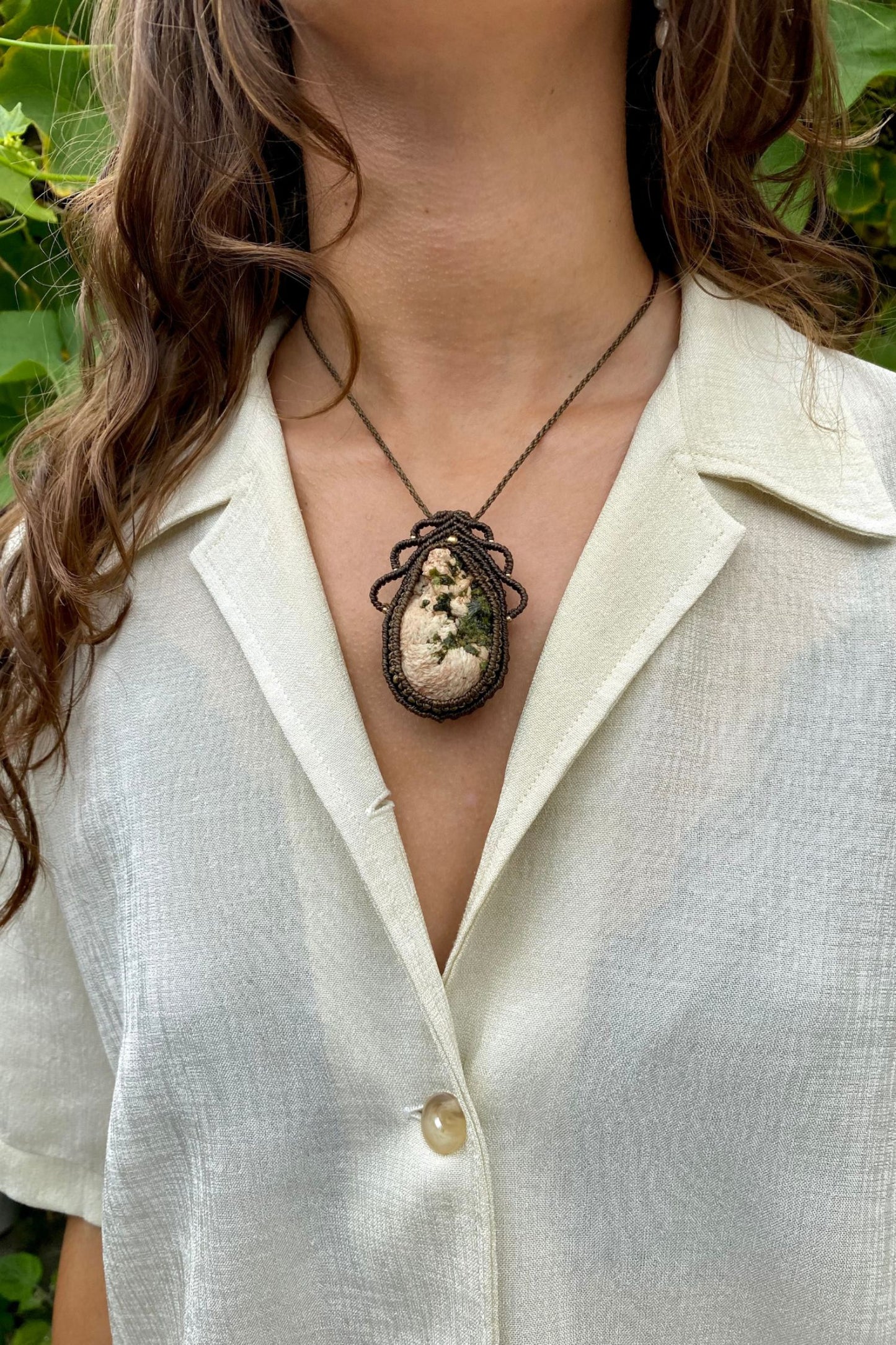 Handmade macrame necklace featuring a raw Prehnite and Epidote gemstone, crafted with a unique and artistic design, offering an adjustable length for a perfect fit.