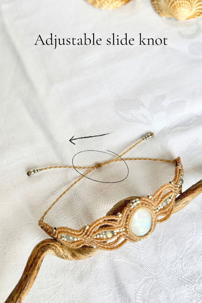 Adjustable sliding knot on the bracelet cord, circled with an arrow to indicate where to adjust the fit.