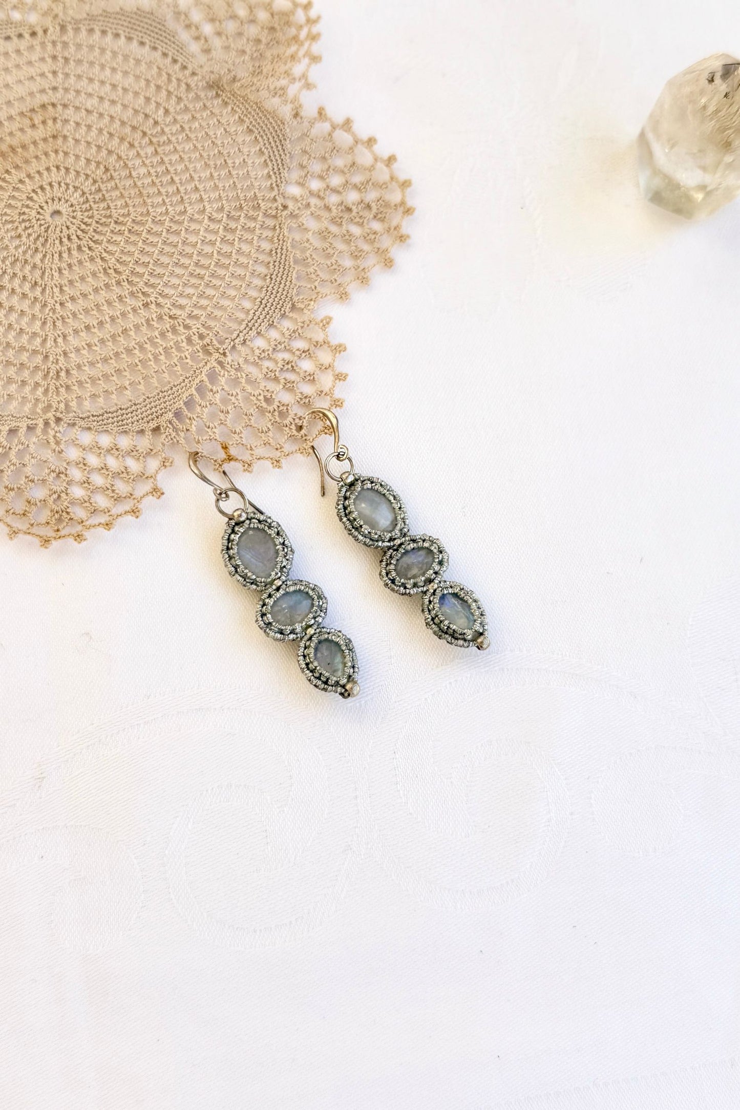 Side-angle view of the handmade macrame earrings with Moonstone. Showcasing depth, knotting details, and stone textures.